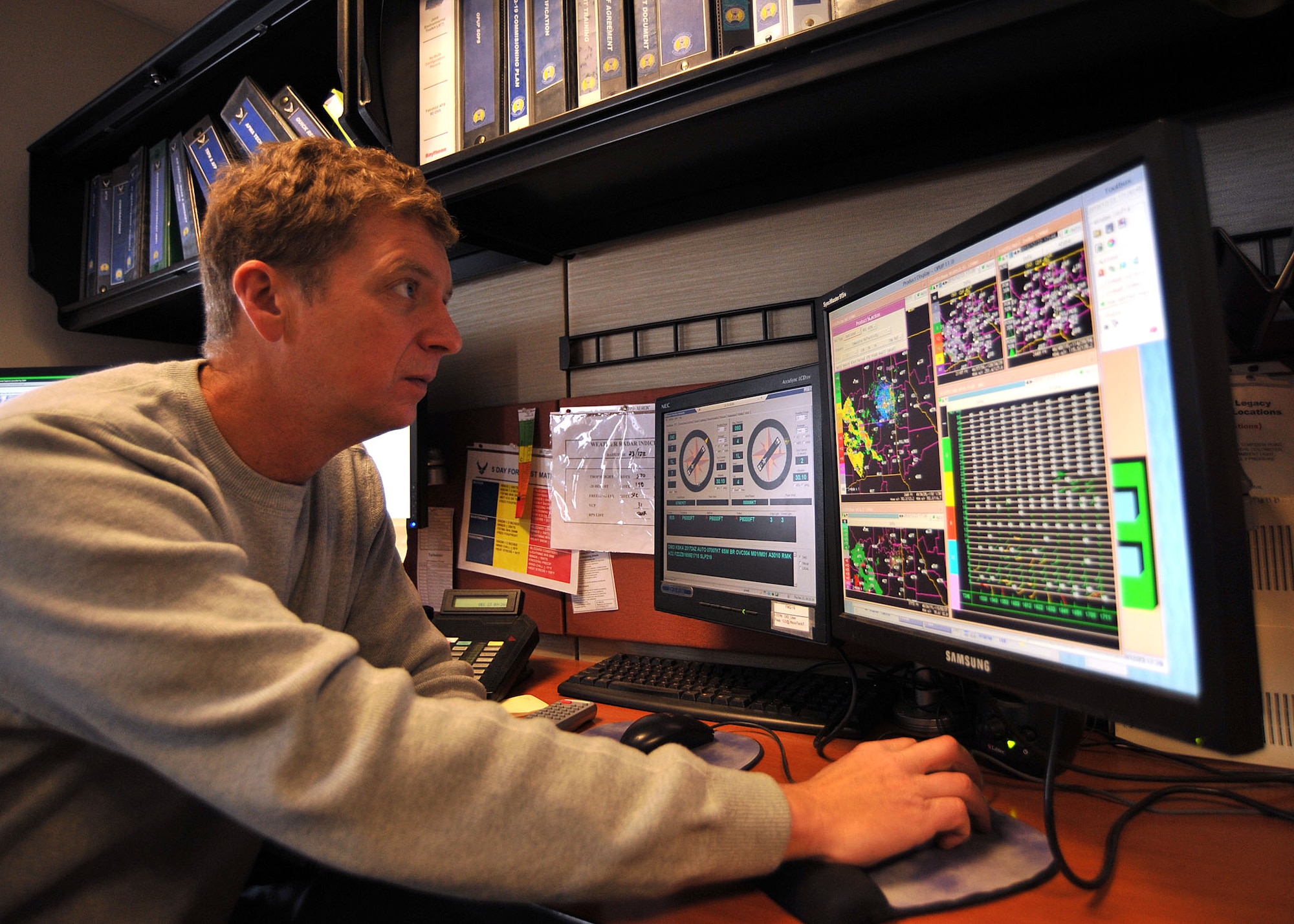 Mr. Travis Schiedt, 92nd Operations Support Squadron lead meteorologist, monitors incoming winter storms Dec. 22, 2010 here. The weather shop plays a pivotal role in Fairchild’s daily flying operation by ensuring the pilots have the most accurate weather forecasts. (U.S. Air Force Photo/Tech. Sgt. JT May III)