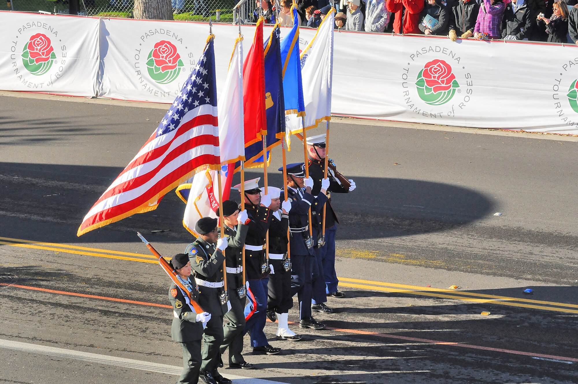 A joint-service honor guard detail performs during the Tournament of Roses parade Jan. 1, 2011. (Photo by Joe Juarez)