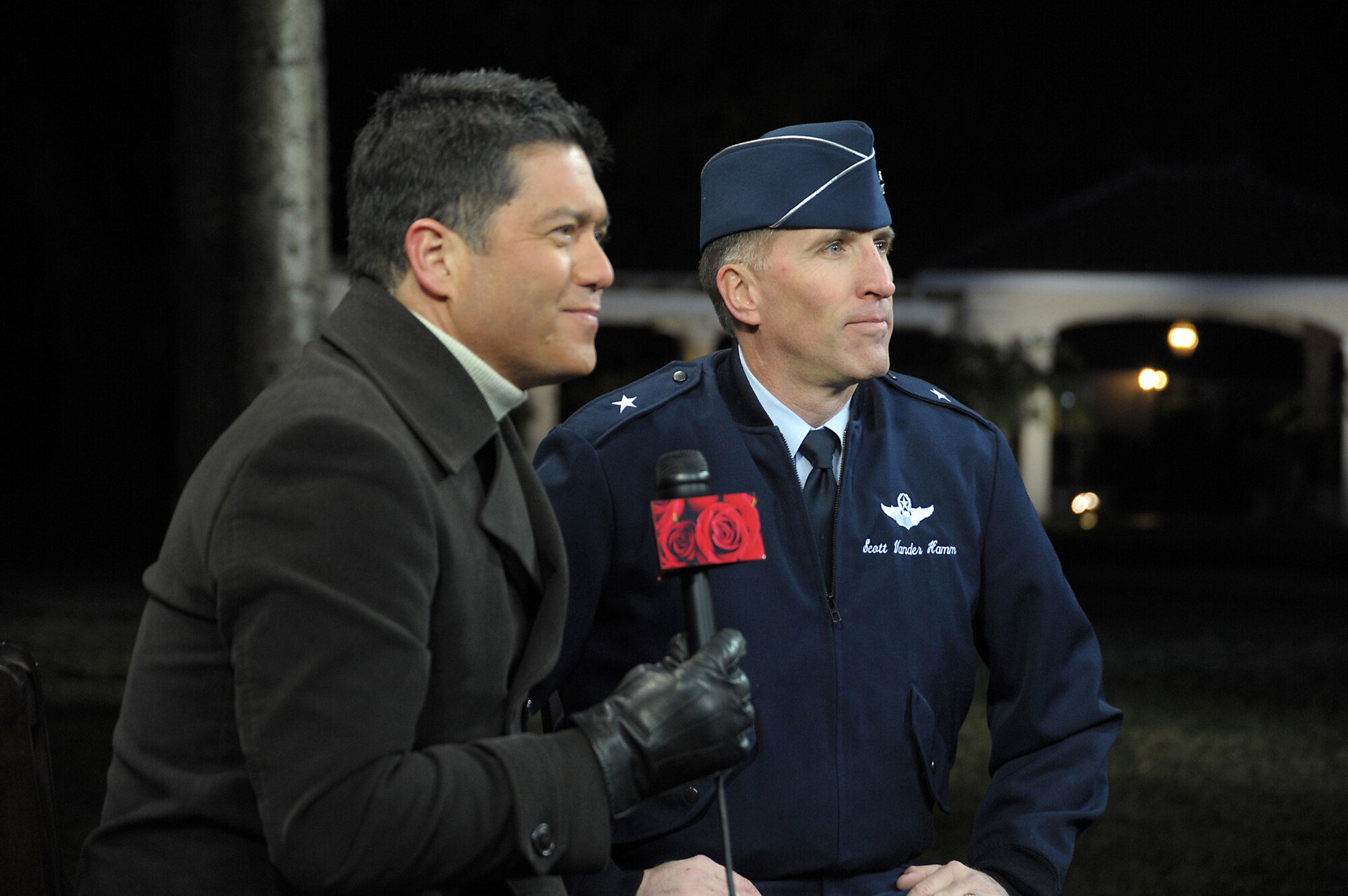 A KTLA 5's reporter (left) interviews Brig. Gen. Scott Vander Hamm, Commander of the 509th Bomber Wing, Whiteman Air Force Base, Mo., prior to the Tournament of Roses parade. A B-2 from 509 BW performed the flyover over Pasadena's 122nd annual parade Jan. 1, 2011. (Photo by Joe Juarez)