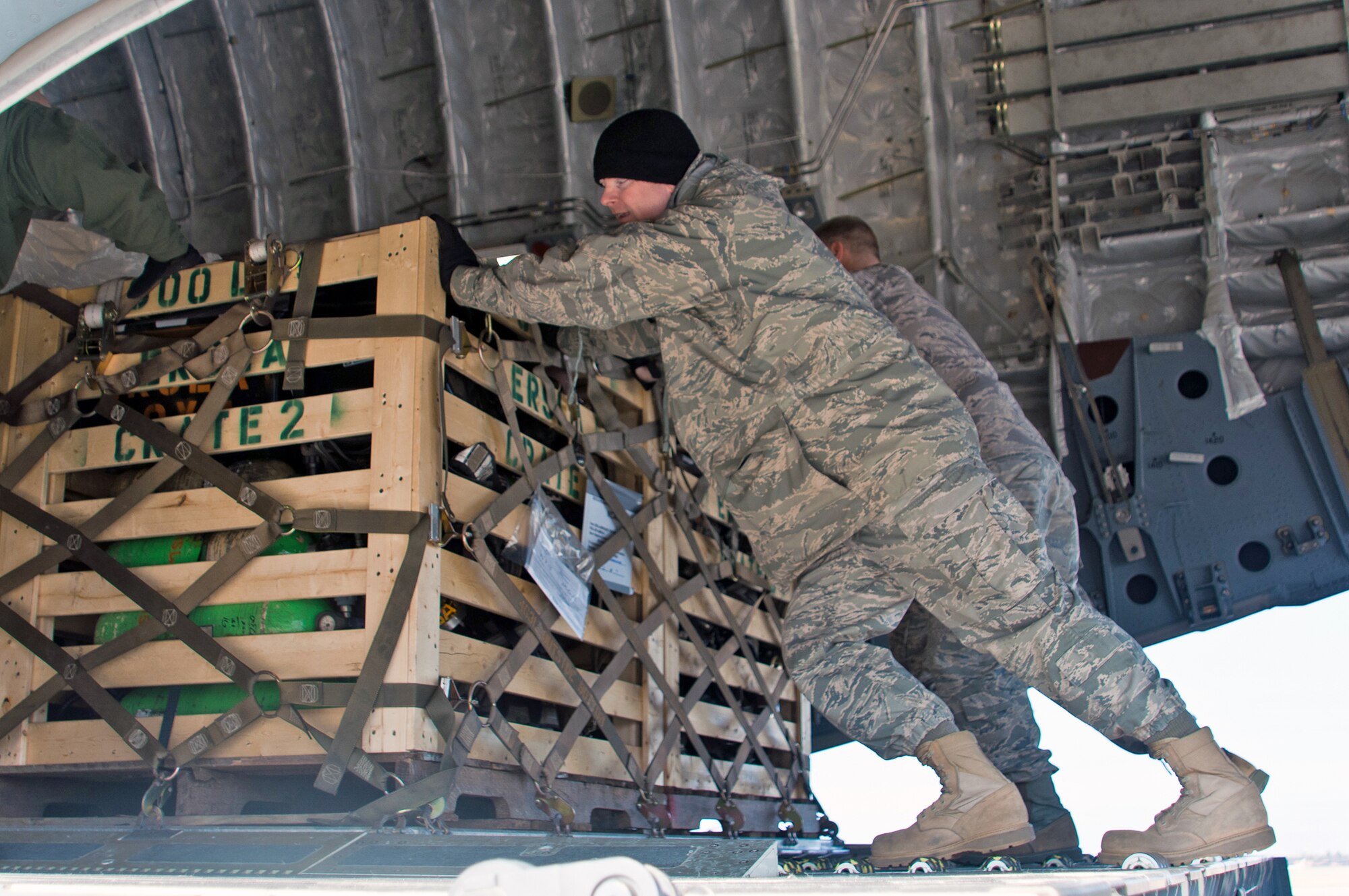 Airmen from the Air Force Reserve Command's 315th Airlift Wing at Charleston Air Force Base, S.C., load medical supplies onto a 315th AW C-17 Globemaster III at Robins AFB, Ga., Dec. 30, 2010.  The aircrew landed here to pick up a fire truck and medical supplies bound for Managua, Nicaragua.  (U.S. Air Force photo/Staff Sgt. Alexy Saltekoff)