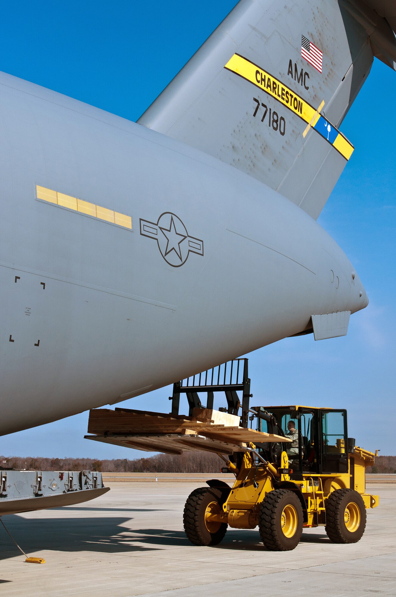 Humanitarian supplies gathered at Robins Air Force Base, Ga., are loaded into a C-17 Globemaster III from the Air Force Reserve Command's 315th Airlift Wing at Charleston AFB, S.C. The 315th AW C-17 landed Dec. 30, 2010, at Robins AFB to pick up a fire truck and medical supplies bound for Managua, Nicaragua.  (U.S. Air Force photo/Staff Sgt. Alexy Saltekoff)