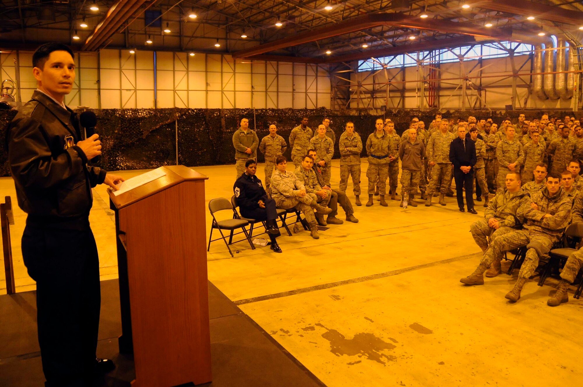 ROYAL AIR FORCE LAKENHEATH, England -- Col. John Quintas, 48th Fighter Wing commander, briefs the 48th Maintenance Group during a wing commander’s call in Hangar 6 Jan. 3. Colonel Quintas held several calls to speak about the wing’s mission and priorities for the upcoming year. (U.S. Air Force photo/Airman 1st Class Eboni Reams)