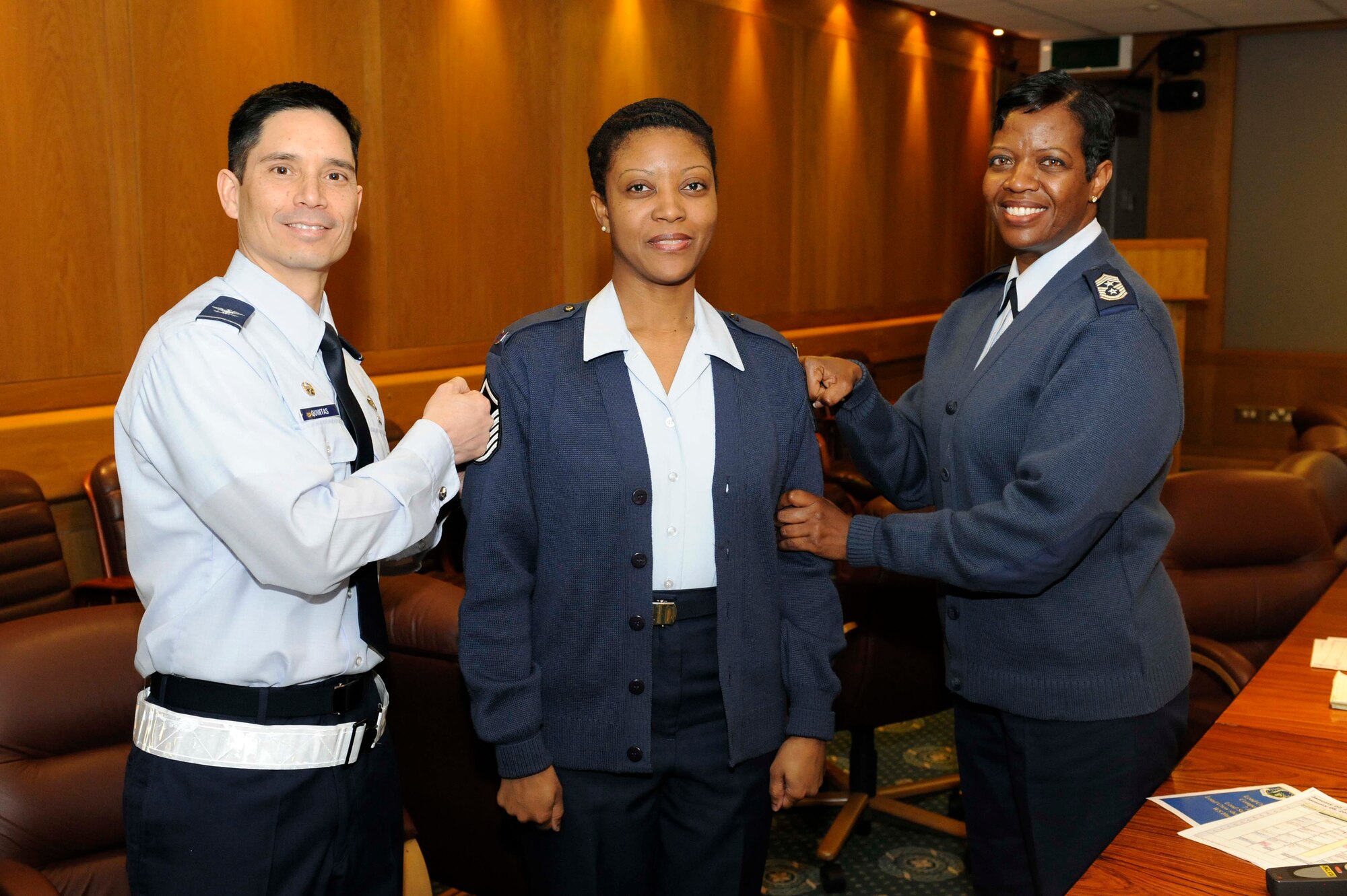 ROYAL AIR FORCE LAKENHEATH, England--Col. John Quintas, 48th Fighter Wing commander, and Chief Master Sgt. SaRita Lathan, 48th Fighter Wing command chief, STEP(Stripes Through Exceptional Performance)  promote now Master Sgt. Charnissa Nathan, 48th Fighter Wing command chief executive assistant, at the wing conference room Jan. 3. The STEP program promotes the top performers of the Air Force nominated by their peers and leadership immediately. (U.S. Air Force photo/Airman 1st Class Eboni Reams) 