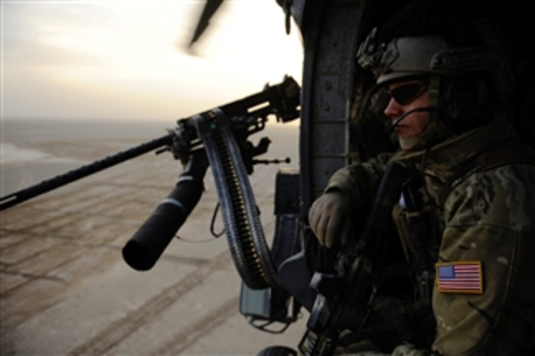 U.S. Air Force Capt. Nick Morgans, a pararescueman with 46th Expeditionary Rescue Squadron, scans his sector on the way to a landing zone during a mission near Kandahar, Afghanistan, on Dec. 24, 2010.  A pararescueman's primary function is as a personnel recovery specialist with emergency medical capabilities in humanitarian and combat environments.  