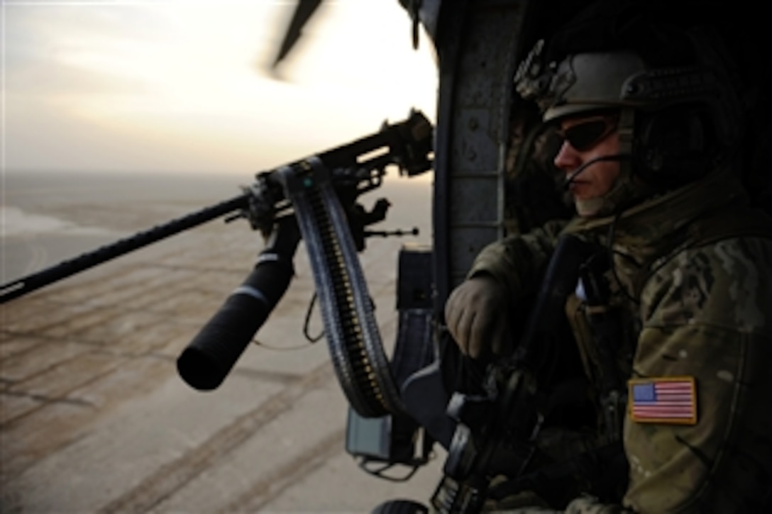 U.S. Air Force Capt. Nick Morgans, a pararescueman with 46th Expeditionary Rescue Squadron, scans his sector on the way to a landing zone during a mission near Kandahar, Afghanistan, on Dec. 24, 2010.  A pararescueman's primary function is as a personnel recovery specialist with emergency medical capabilities in humanitarian and combat environments.  