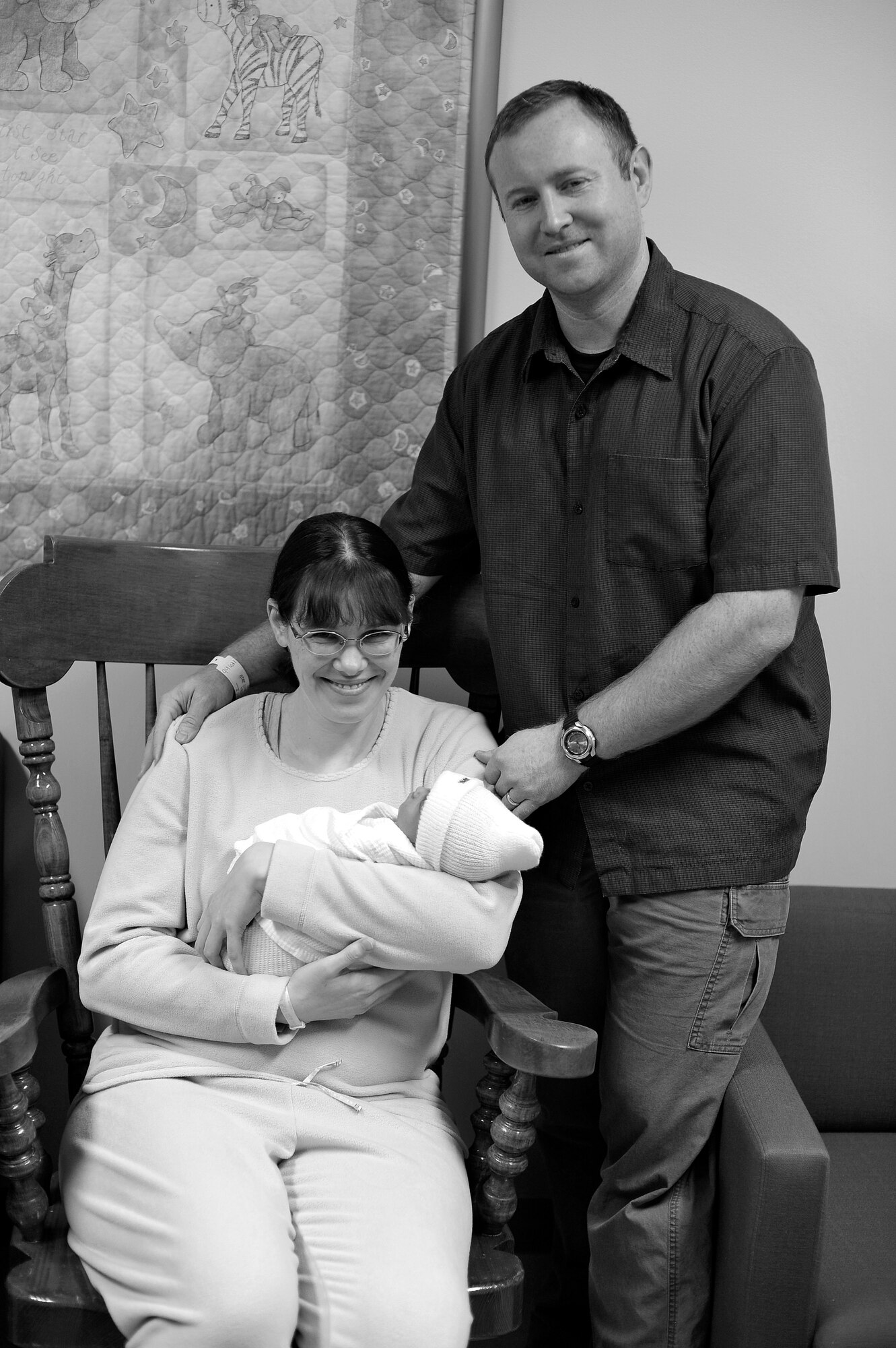 Anne Ham holds her newborn baby, Ellianna Katelyn Ham, with her husband, Navy Petty Officer Nicholas Ham, at the 35th Medical Group Jan. 5, 2011. Ellianna was born on Jan. 3 at 4:10 p.m. and was the first baby born at Misawa Air Base in the new year. (U.S. Air Force photo by Staff Sgt. Chad C. Strohmeyer)