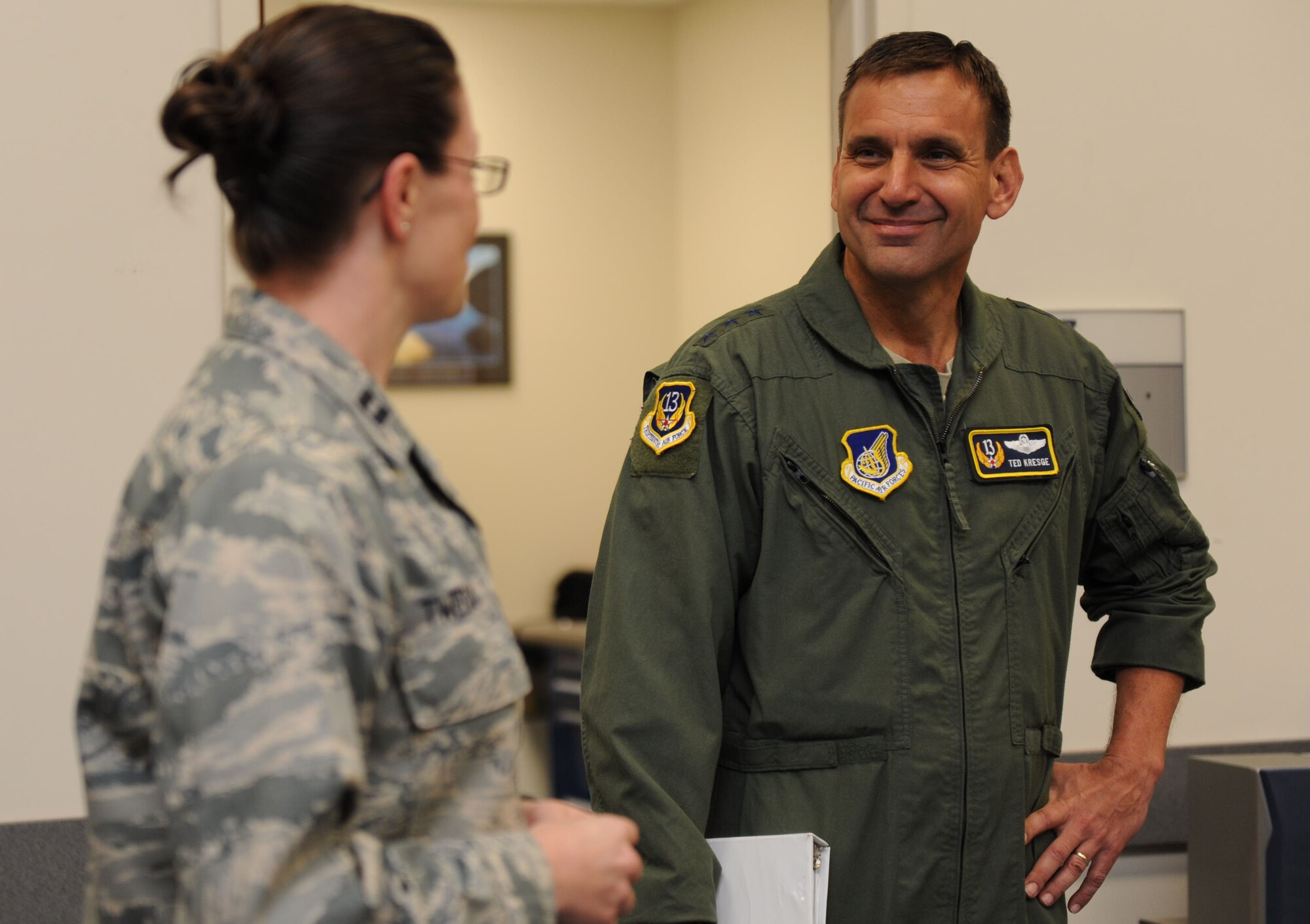 Lt. Gen. Ted Kresge, 13th Air Force commander, is guided through a tour by Capt. Sharon Tweedy, Aerospace Flight Equipment commander, during a visit to the C-17 Operations building at the 15th Wing Jan. 4. General Kresge met with Airmen and learned the mission and functions of various units here during his visit to the wing. (U.S. Air Force photo/Airman 1st Class Lauren Main)