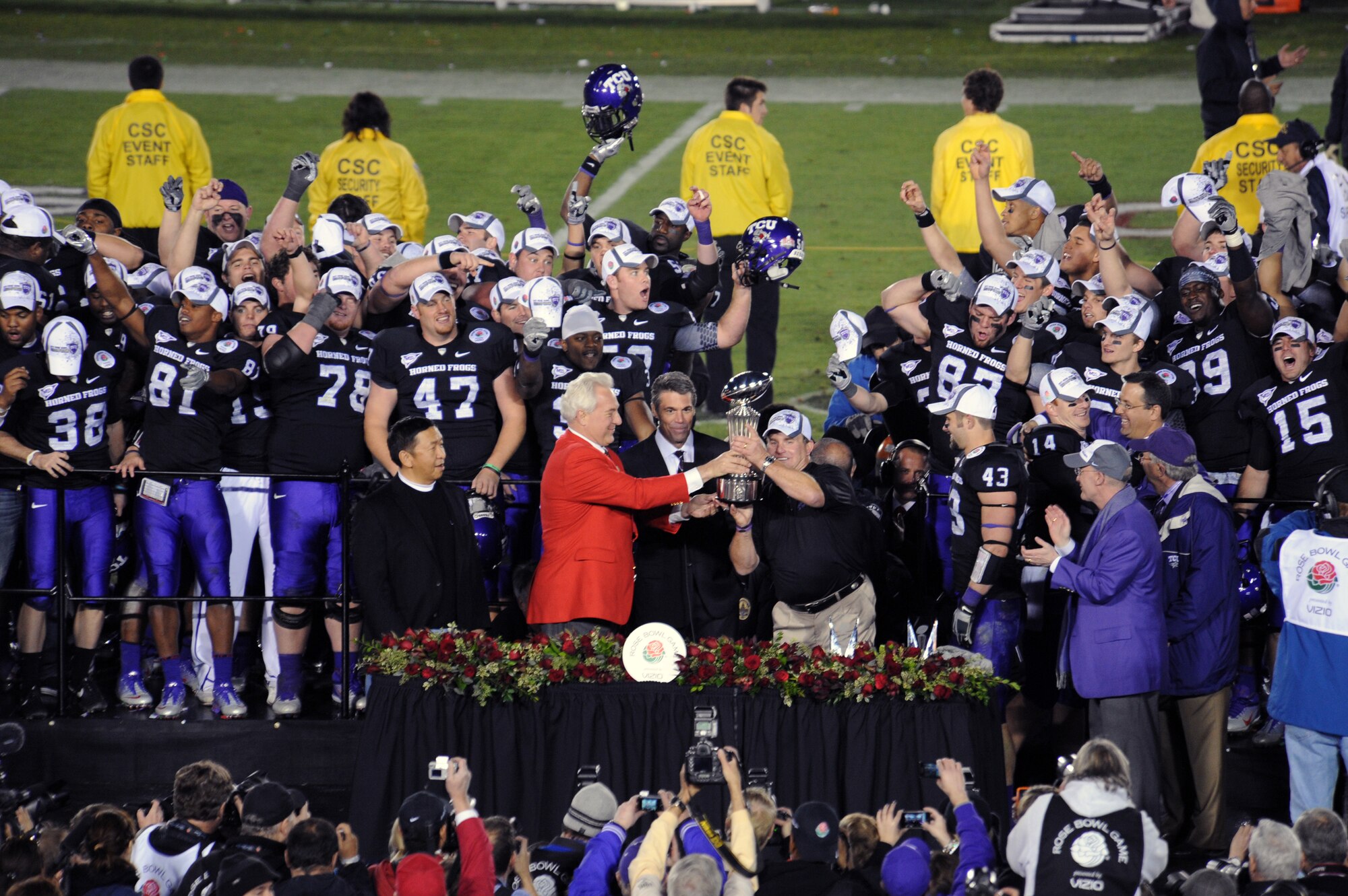WHITEMAN AIR FORCE BASE, Mo. -- Jeffrey Throop, President of Tournament of Roses, presents Gary Patterson, Texas Christian University head coach, the Rose Bowl Champions Trophy. TCU beat Wisconsin 21-19 at the 97th Annual Rose Bowl game.
(U.S. Air Force photo by Staff Sgt. Jason Huddleston) (Released)
