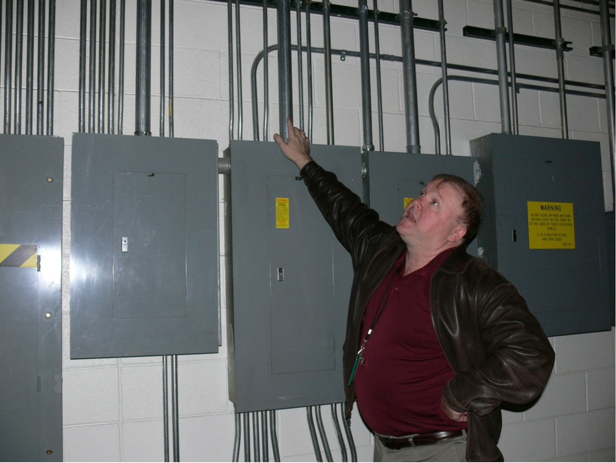 Kevin Spala, Cape senior project manager, looks at some of the material including electrical boxes and light fixtures, which will be salvaged in the deconstruction of the former commissary, built in 1974, on Peterson Air Force Base. The demolition project is expected to begin Jan. 10 and be complete by mid-April. Crews will set up a staging area to the north of the building, at the corner of Otis Street and Stewart Avenue. The project will not affect visitors to the housing office, Building 1425. (U.S. Air Force photo/Monica Mendoza)