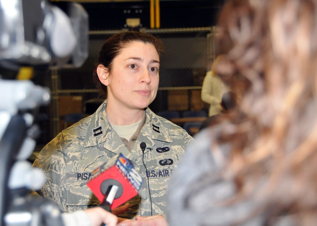 Capt. Jessica Pisano 914th Airlift Wing Aircraft Maintenance Squadron commander answers questions from the local media regarding her deployment, January 4, 2011 Niagara Falls Air Reserve Station, Niagara Falls, NY. Capt. Pisano is one of more than 140 Wing members being deployed in support of contingency operations in Southwest Asia. (U.S. Air Force photo by Staff Sgt. Joseph McKee)
