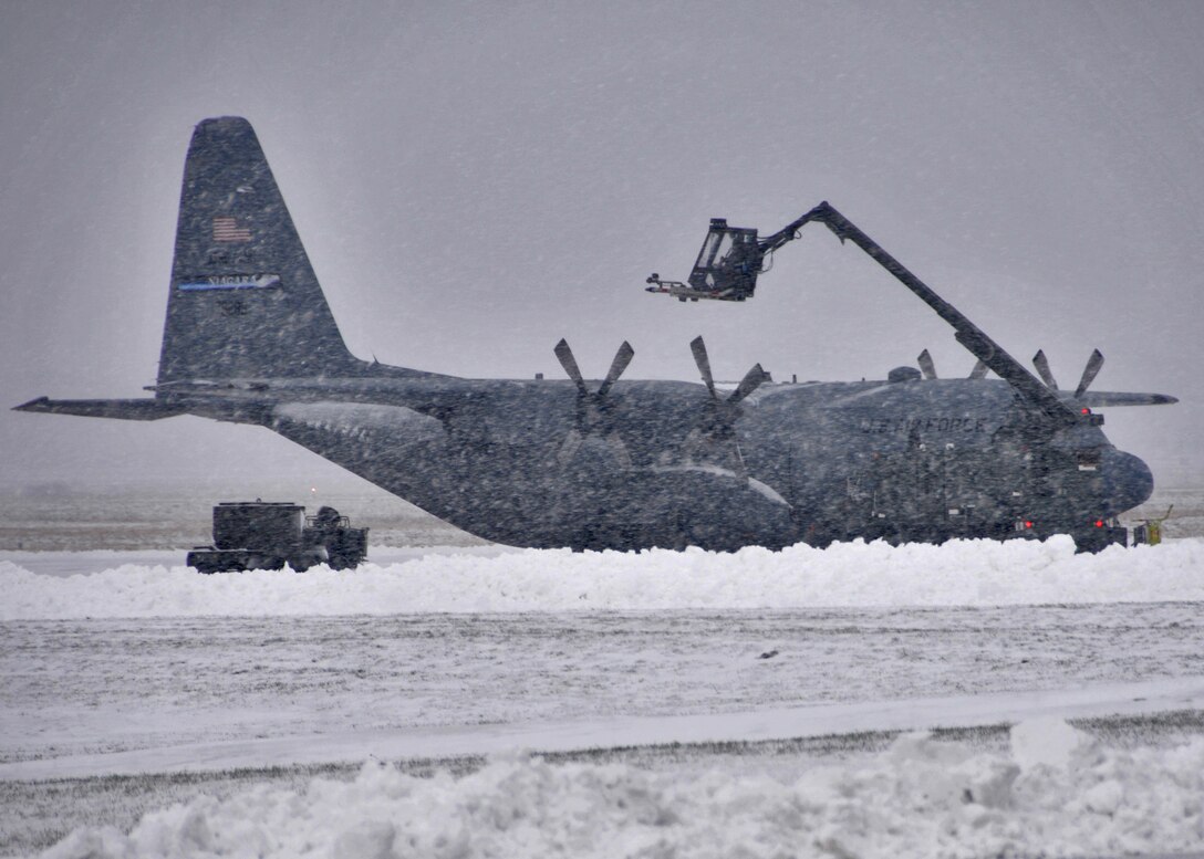 Members of the 914th Airlift Wing deice a C-130 on the flightline February 4, 2011 Niagara Falls Air Reserve Station, Niagara Falls, NY. When there are freezing conditions and precipitation, de-icing an aircraft is crucial. Frozen contaminants can make critical control surfaces rough and uneven, which can disrupt smooth air flow and greatly reduce the ability of the wing to generate lift. This situation can cause a crash. If large pieces of ice separate when the aircraft is in motion, they can be sucked into engines or damage propellers causing possible failure. Ice can jam control surfaces, preventing them from working properly. Because of this potentially severe consequence, de-icing is performed at airports where temperatures are likely to be around 0°C. (U.S. Air Force photo by Staff Sgt. Joseph McKee)