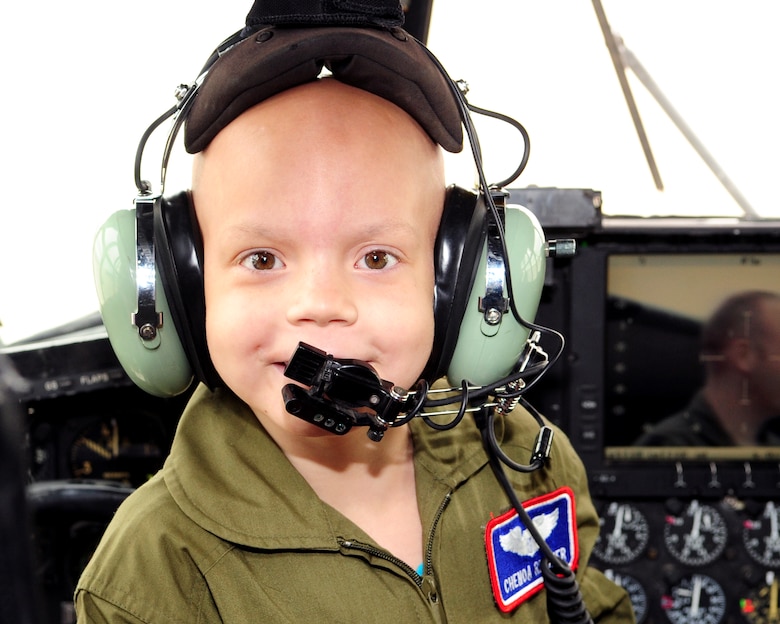 DAVIS-MONTHAN AIR FORCE BASE, Ariz. - Seven-year-old Pilot for a Day participant Chenoa Richner, smiles in the cockpit of a HC-130 Hercules while wearing a headset used to communicate between pilot and co-pilot as part of the Pilot for a Day tour here Dec. 29. As part of her tour, Chenoa and her family visited the 354th Fighter Squadron, the air traffic control tower, the D-M Fire Department and several aircraft static displays. The Pilot for a Day Program is designed to give local children with illnesses an enjoyable day completely devoted to them and their interest in aviation. (U.S. Air Force photo/Airman 1st Class Michael Washburn)