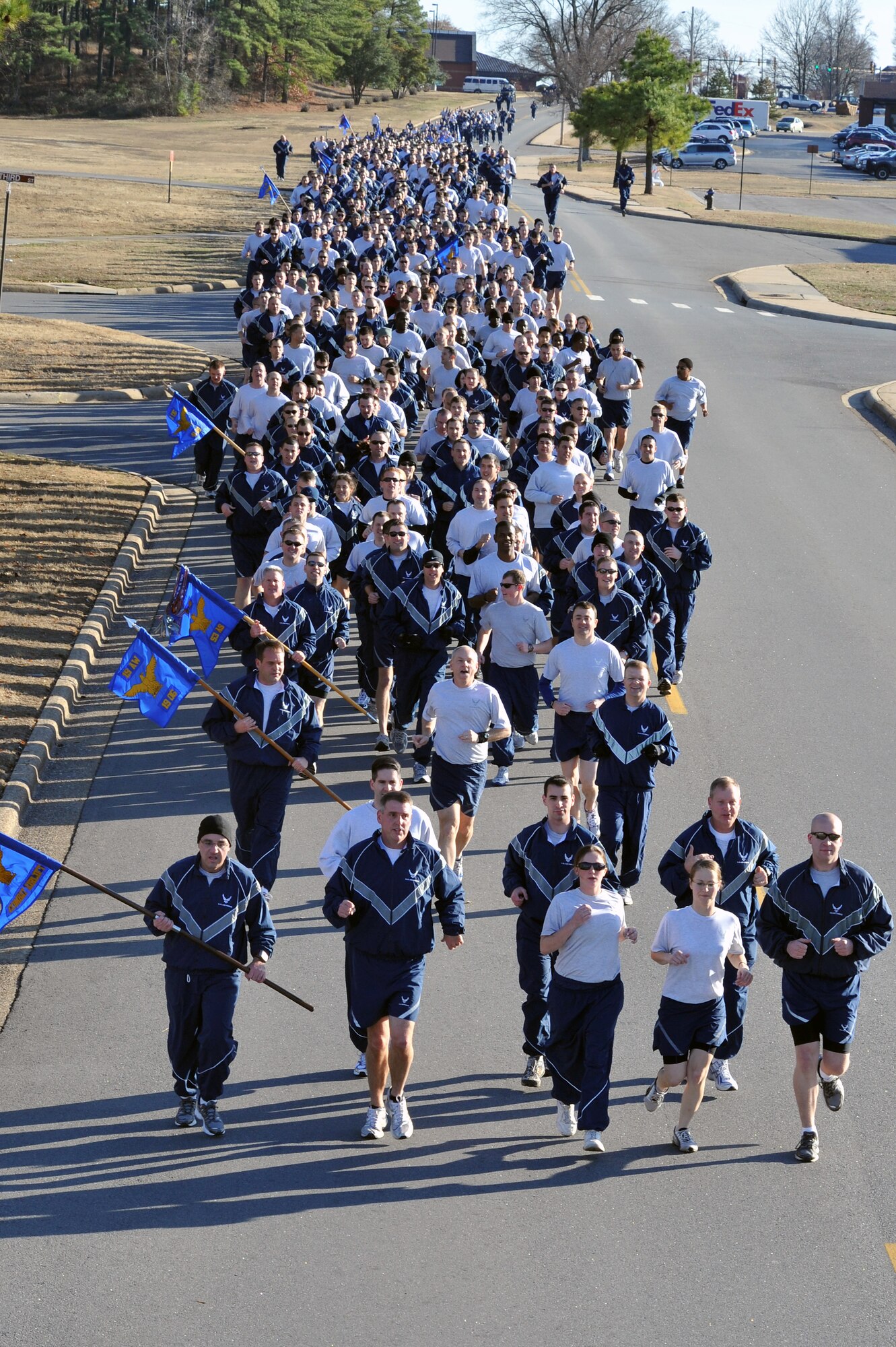 Team Little Rock members run down Thomas Ave during the 5 km Wingman Day run Jan. 3, 2010, at Little Rock Air Force Base.  The run was the final portion of Wingman Day, which was a day for all agencies to focus on top Air Force issues and team building events. (U.S. Air Force photo by Staff Sgt. Chris Willis)