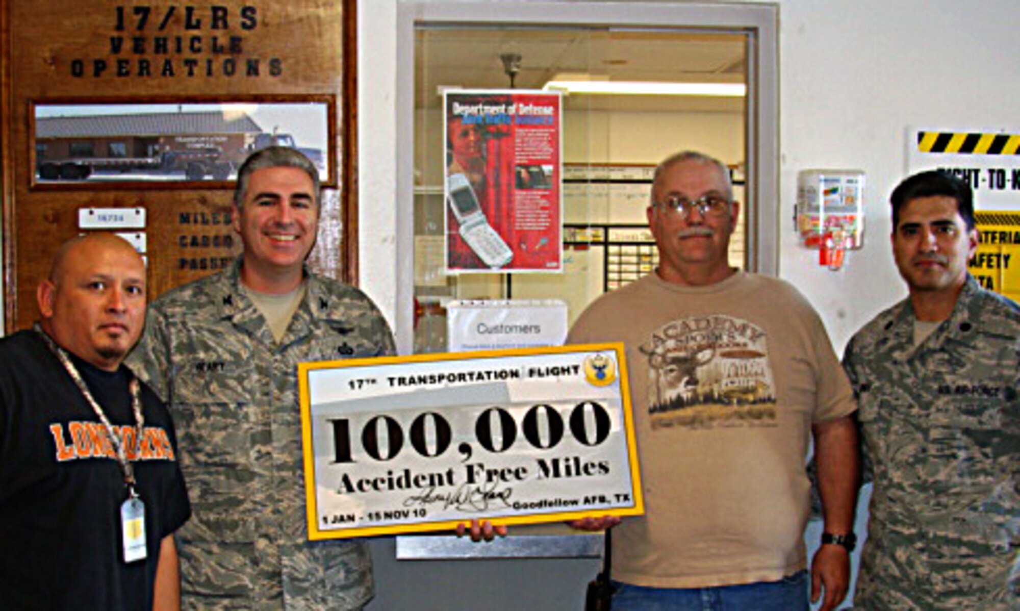 GOODFELLOW AIR FORCE BASE, Texas -- Col. Thomas Geary, 17th Training Wing Commander, presents a memento to 17th Logistics Readiness Transportation Flight vehicle operators for driving 138,215 miles in 2010 without a single vehicle accident.  The vehicle operators drive across Texas, covering more than 105,000 square miles, or about 40 percent of Texas. (Courtesy photo)