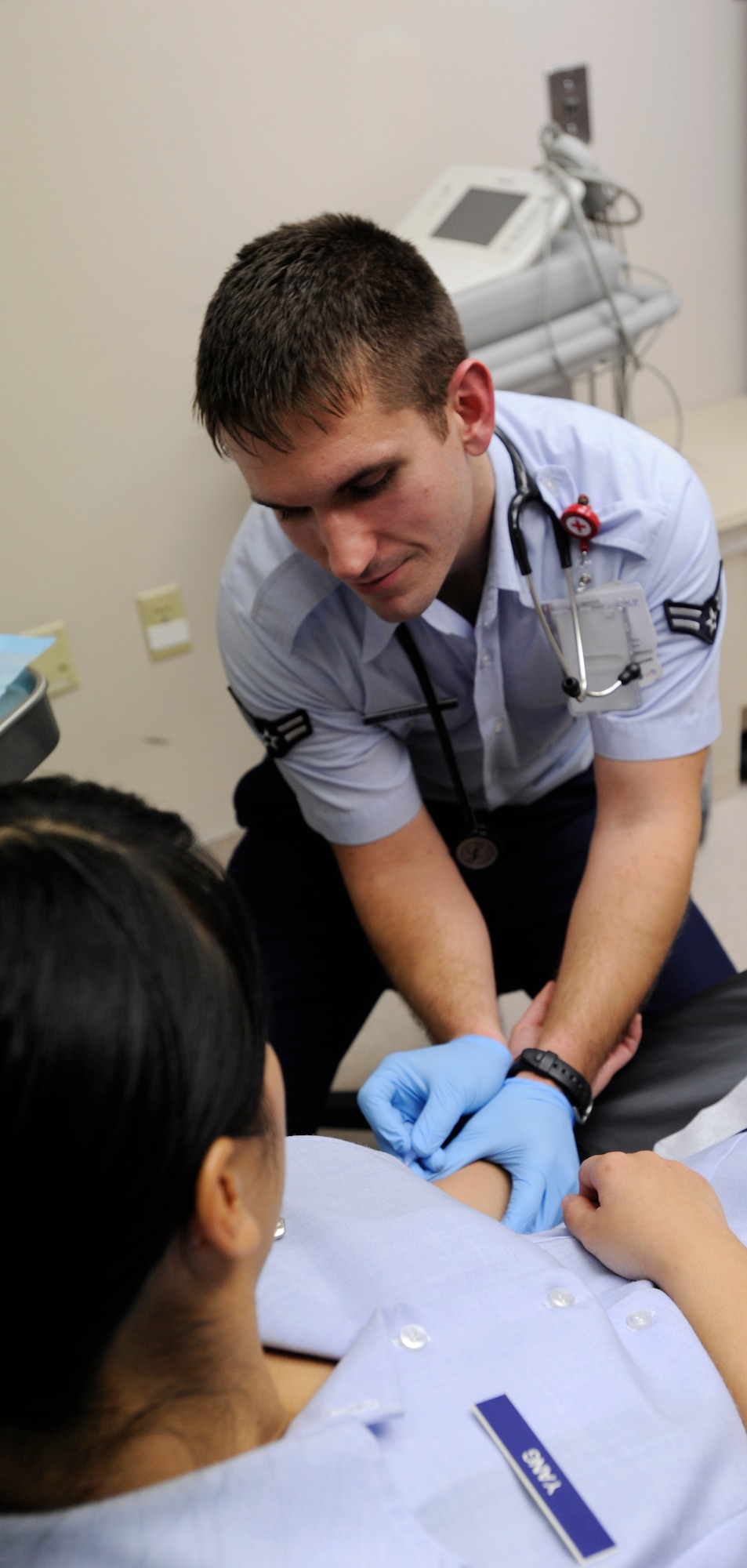 Airman 1st Class Matthew Scott Santino, 22nd Medical Operation Squadron aerospace medical services technician, demonstrates how to insert an intravenous solution, Dec. 17, 2010, McConnell Air Force Base, Kan. In addition to assisting doctors at the 22nd Medical Group, Airman Santino gathers information to help treats patients’ illnesses or injuries. (U.S. Air Force photo/Senior Airman Armando A. Schwier-Morales)