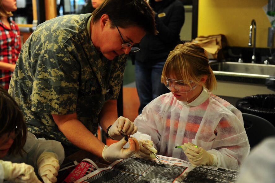 DYESS AIR FORCE BASE, Texas—Dr. Denise Ruark, Dyess veterinarian, explains the different parts of a deer Jan. 3 at the youth center here as children participate in the dissection. The youth center is open to children five to 18, and offers different programs and activities for each age group. For more information, call (325) 696–4797. (U.S. Air Force photo/ Airman First Class Courtney Moses)