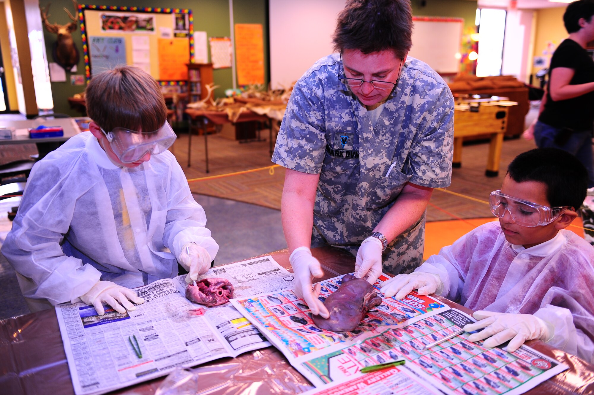 DYESS AIR FORCE BASE, Texas—Dr. Denise Ruark, Dyess veterinarian, explains the different parts of a deer Jan. 3 at the youth center here as children participate in the dissection. The youth center is open to children five to 18, and offers different programs and activities for each age group. For more information, call (325) 696–4797. (U.S. Air Force photo/ Airman First Class Courtney Moses)