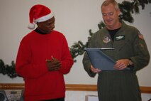 Operations Support Squadron First Sergeant Terry McCabe (left) is presented a gift from Lt. Col. Brian Davis upon his departure from the OSS in December. The wing will convene a first sergeant selection board in March to fill vacancies throughout the 916th ARW. (USAF photo by Maj. Shannon Mann, 916ARW/PA)