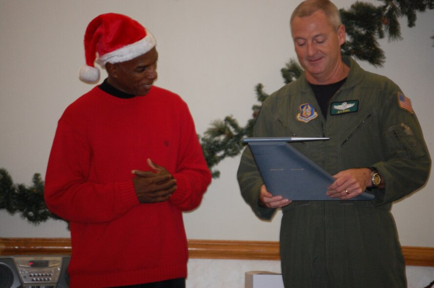 Operations Support Squadron First Sergeant Terry McCabe (left) is presented a gift from Lt. Col. Brian Davis upon his departure from the OSS in December. The wing will convene a first sergeant selection board in March to fill vacancies throughout the 916th ARW. (USAF photo by Maj. Shannon Mann, 916ARW/PA)