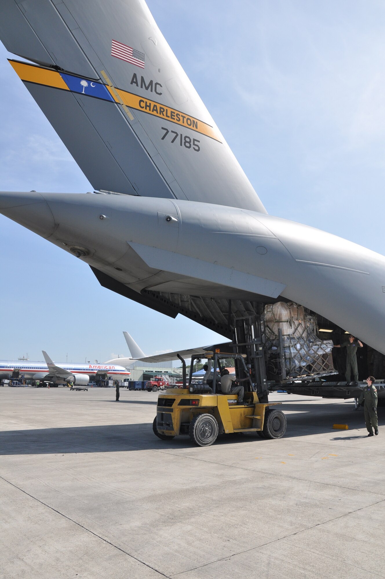 Aerial porters from the 81st Aerial Port Squadron, Joint Base Charleston, S.C., offload aid from a C-17 Globemaster III to the people of Haiti during a training and humanitarian mission to Haiti and Grenada Dec. 30, 2010. (U.S. Air Force photo/Senior Airman Robert Pilch)