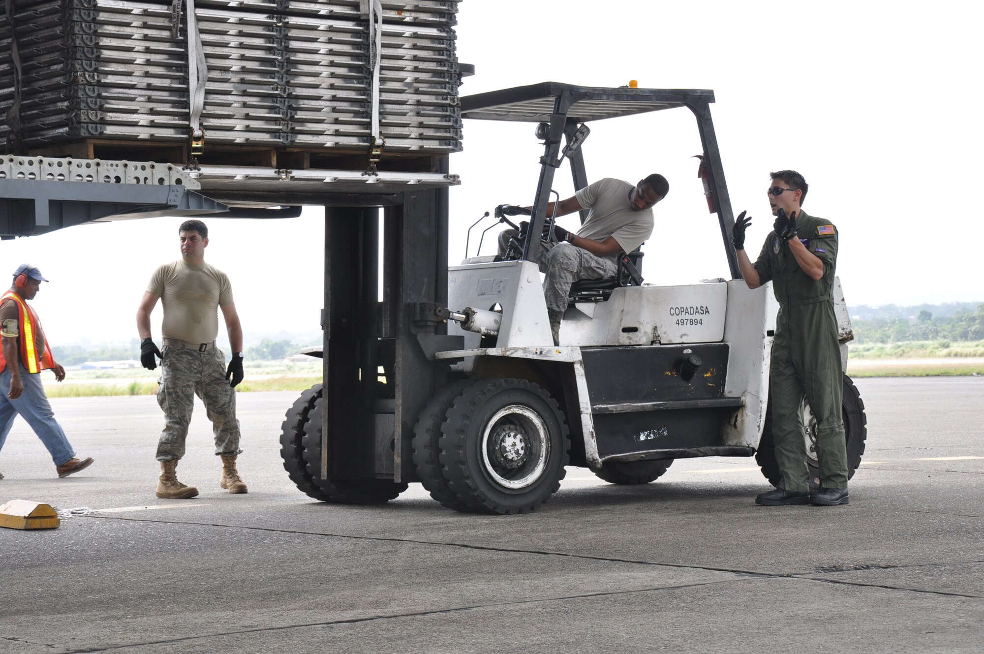 Aerial porters from the 81st Aerial Port Squadron, Joint Base Charleston, S.C., load empty pallets aboard a C-17 Globemaster III before leaving Panama during a training and humanitarian mission to Haiti and Grenada Dec. 30, 2010. (U.S. Air Force photo/Senior Airman Robert Pilch)