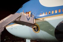President Barack Obama and his wife Michelle wave as they prepare to depart the 15th Wing at Joint Base Pearl-Harbor Hickam, Hawaii, Jan. 3. The President arrived on Dec. 22, and Air Force One remained parked at the 15th Wing while the President vacationed in Hawaii with his family. (U.S. Air Force photo/Staff Sgt. Nathan Allen)