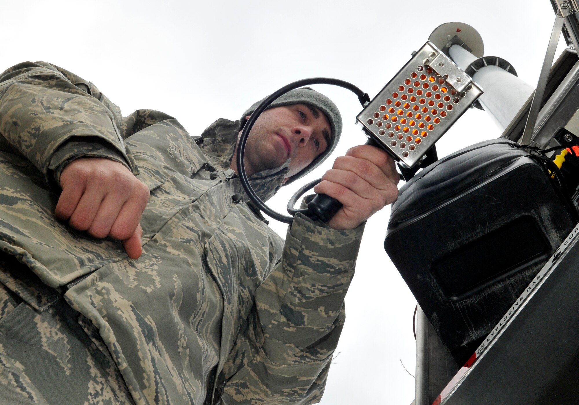 U.S. Air Force Senior Airman Cory Littlefield, 35th Communications Squadron, radio frequency transmission systems technician, tests the battery amperage of the mass notification system Dec. 4, 2010; Misawa Air Base, Japan. The tester uses high resistance coils, which heats up when energized. RFTS technicians maintain more than 200 devices at over 128 locations. (U.S. Air Force photo by Tech. Sgt. Phillip Butterfield/Released)