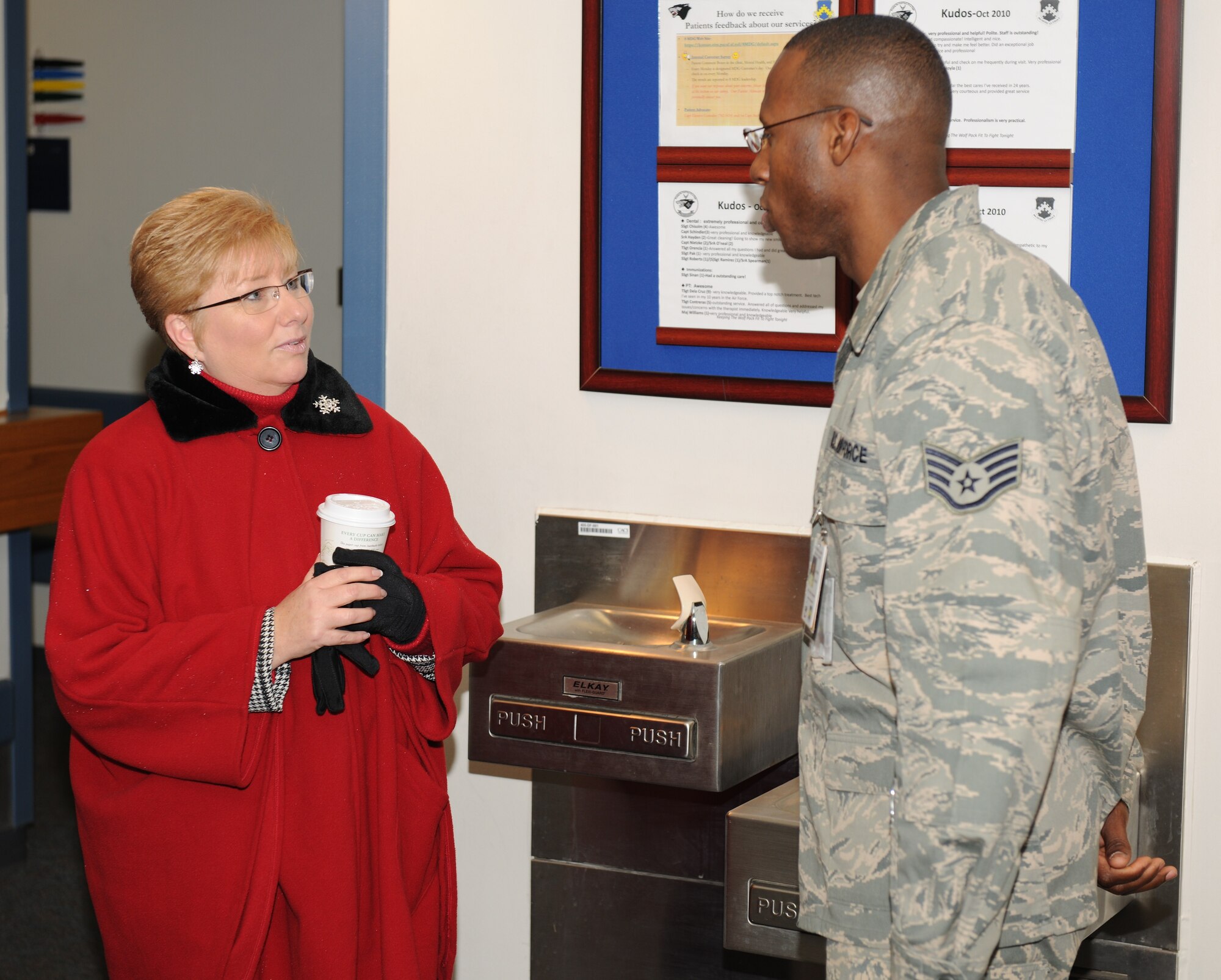 KUNSAN AIR BASE, Republic of Korea -- Paula Roy, wife of Chief Master Sgt. of the Air Force James Roy, talks with Staff Sgt. Wilsondo Alteus, 8th Medical Operations Squadron flight medicine technician, during her visit to the clinic here Dec. 30. Chief and Mrs. Roy visited the Wolf Pack Dec. 29 and 30 during their year-end tour of Pacific Air Forces bases. (U.S. Air Force photo/Master Sgt. Jason Wilkerson)