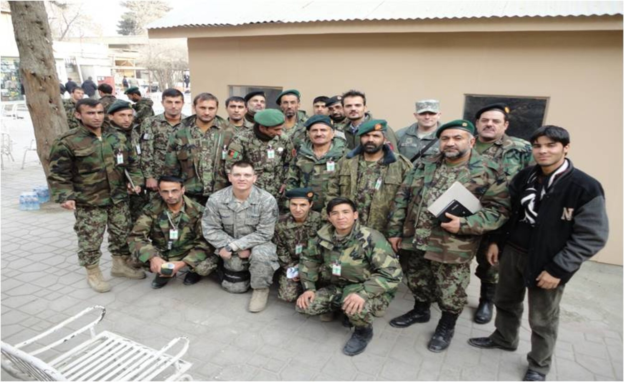 Camp Eggers, Afghanistan – Members of the Afghan National Army Criminal Investigation Command pose for a photo with their mentors after a successful crime scene processing, securing and fingerprint analysis at Camp Eggers, Afghanistan. (U.S. Air Force photo / Released)