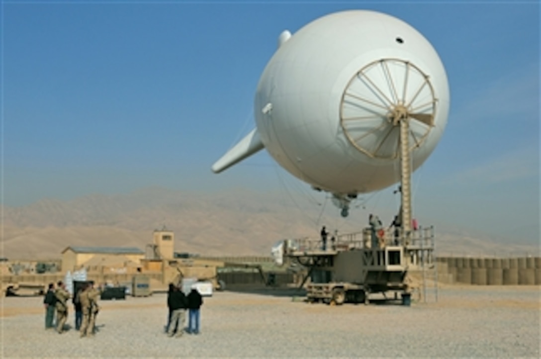 A persistent surveillance system launches from Forward Operating Base Khilegay, Afghanistan, on Dec. 30, 2010.  The persistent surveillance system consists of an aerostat, also called a blimp, and mounted camera equipment capable of high-resolution imagery and high-quality video that provides instant situational awareness throughout the region.  