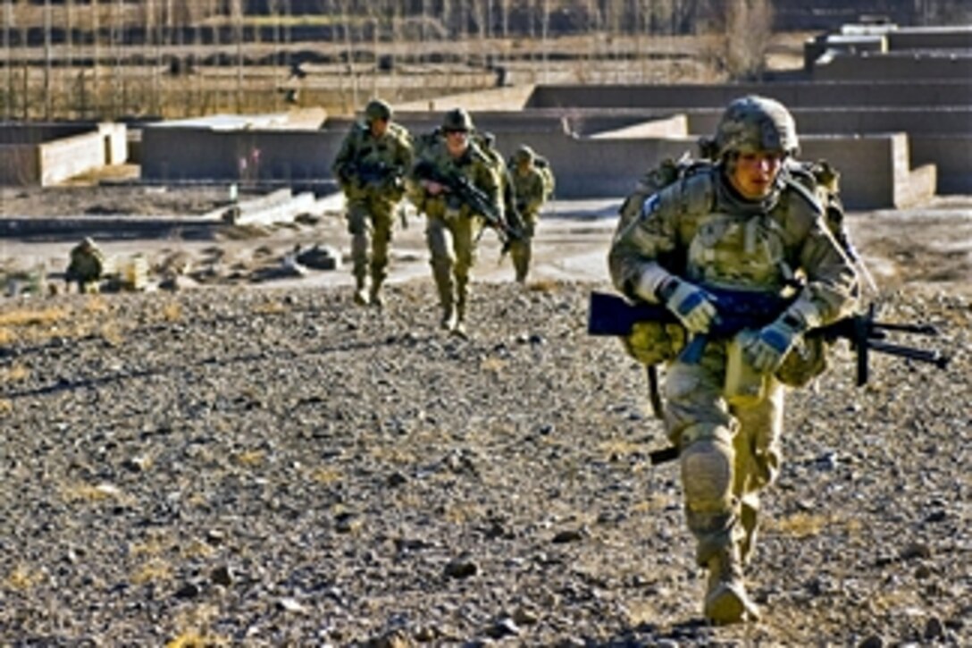 U.S. and Afghan troops work to gain high ground before moving into a hostile village on day three of a six-day dismounted operation in Logar province, Afghanistan, on Dec. 21, 2010.  The soldiers, assigned to the 10th Mountain Division's Company C, 2nd Battalion, 30th Infantry Regiment, 4th Brigade Combat Team, pushed through western Baraki Barak to eliminate Taliban influence and establish a government presence.  