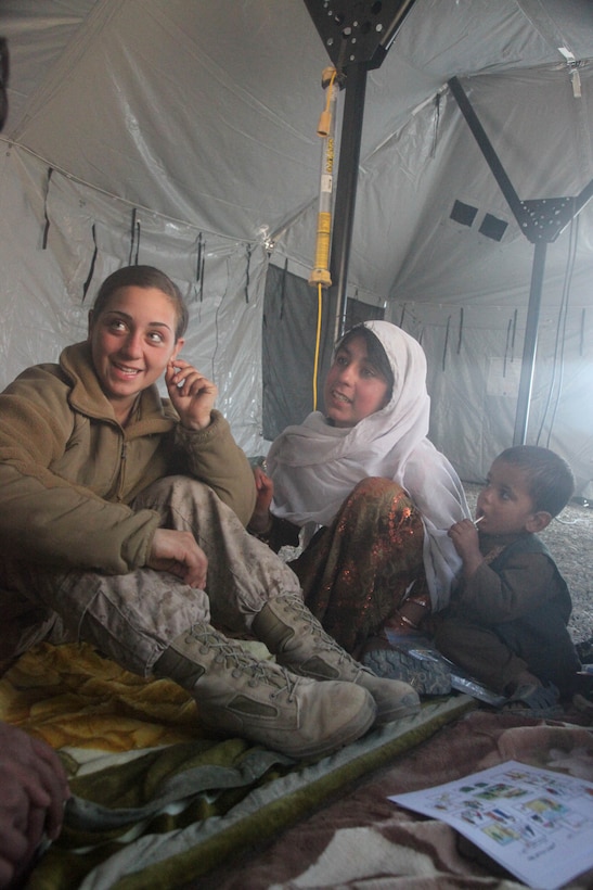 U.S. Marine Corps Lance Cpl. Sienna G. De Santes, left, with a female engagement team supporting 3rd Battalion, 5th Marines, helps give a medical class during a health initiative in Sangin, Helmand province, Afghanistan, Jan. 4, 2011. During the health initiative, local health care providers were trained to treat sick and injured Afghans.