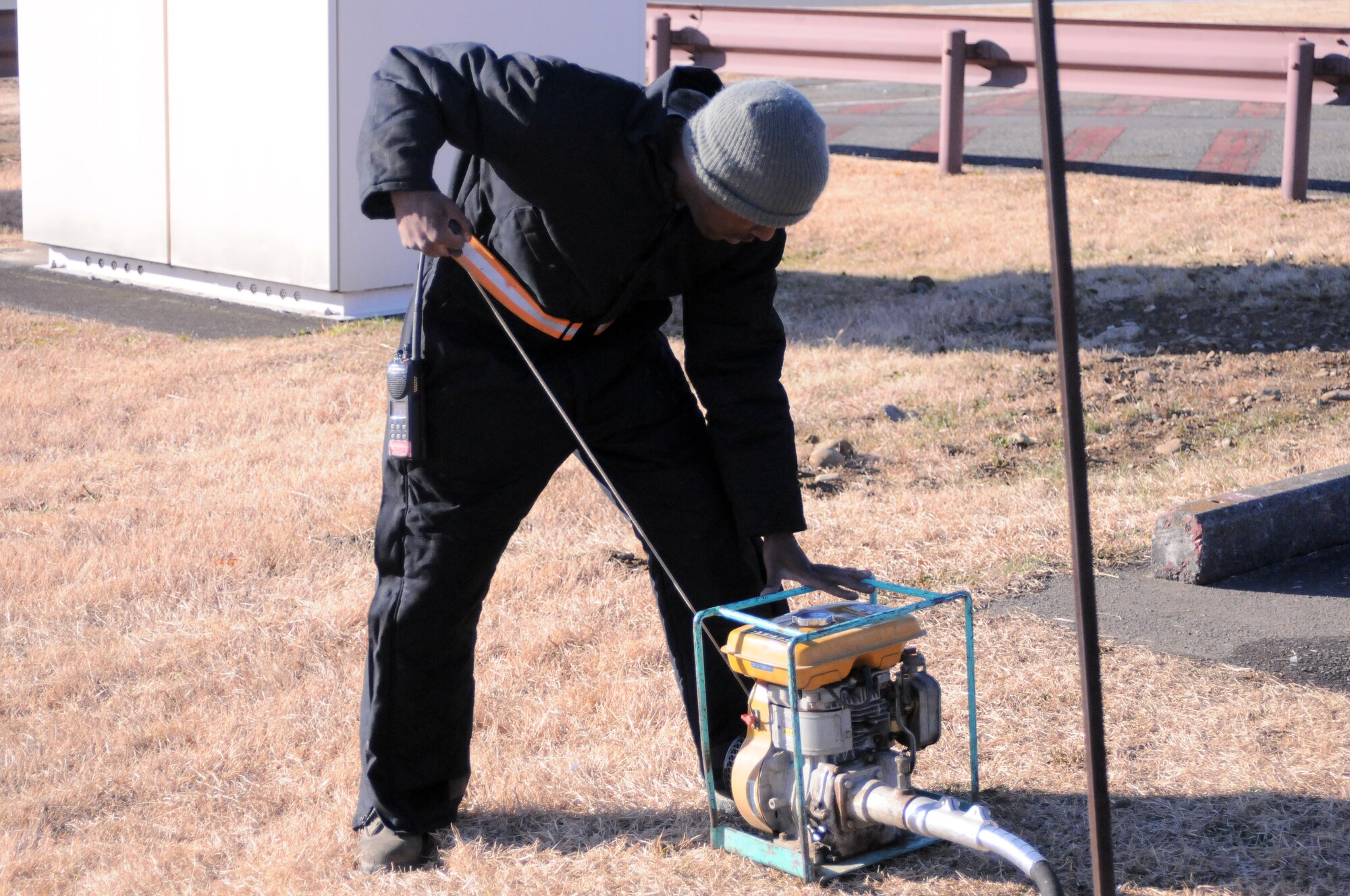 YOKOTA AIR BASE, Japan -- Staff Sgt. Antonio Peals, NCO in charge of the Washrack, starts a sewage pump at the Washrack, here Jan. 5. The Washrack is where Yokota's C-130 Hercules aircraft are washed and treated for corrosive materials. (U.S. Air Force photo/ Airman 1st Class Katrina R. Menchaca)