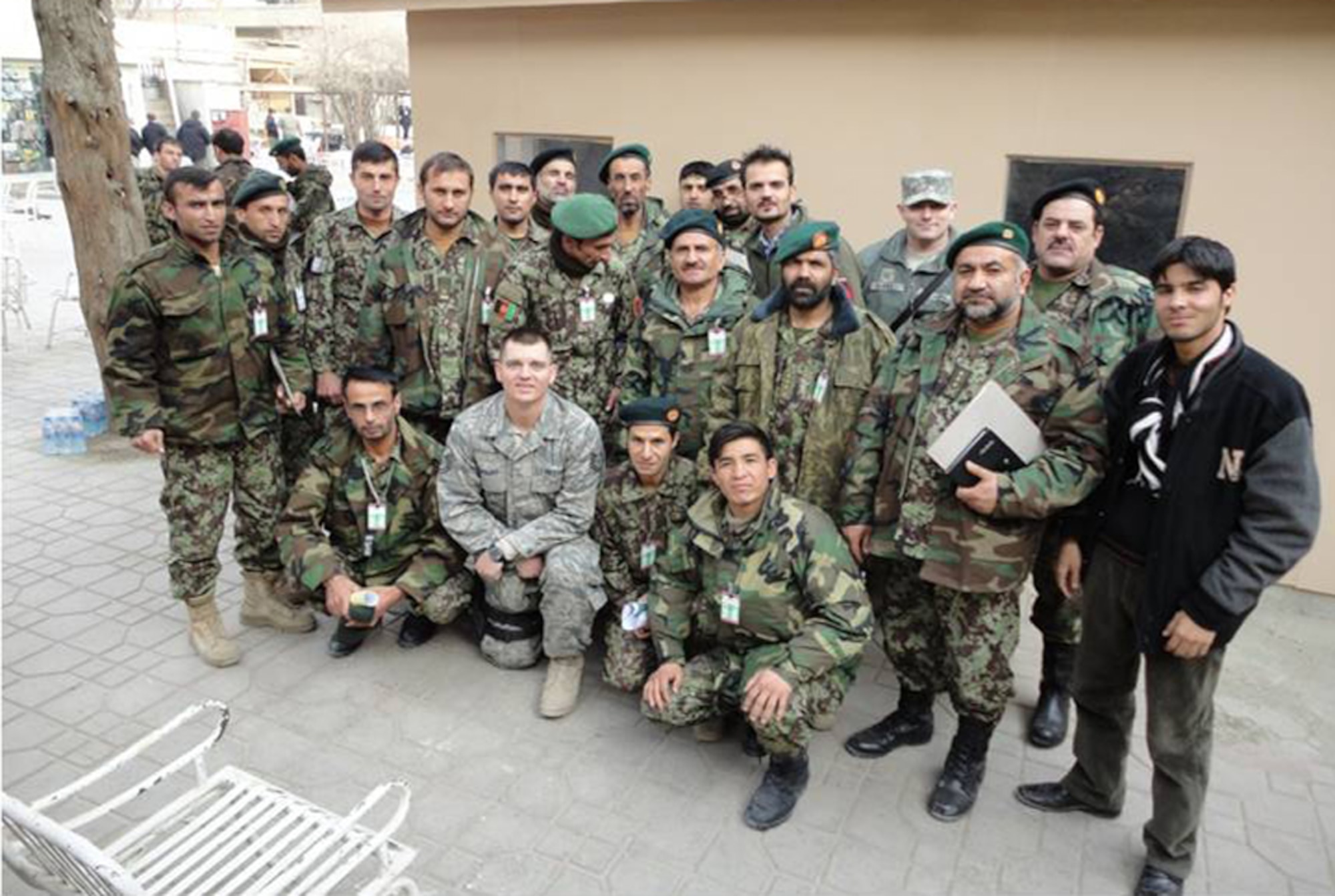 Members of the Afghan National Army Criminal Investigation Command pose for a photo with their mentors after a successful crime-scene processing, securing and fingerprint analysis Jan. 3, 2011, at Camp Eggers, Afghanistan. (U.S. Air Force photo)