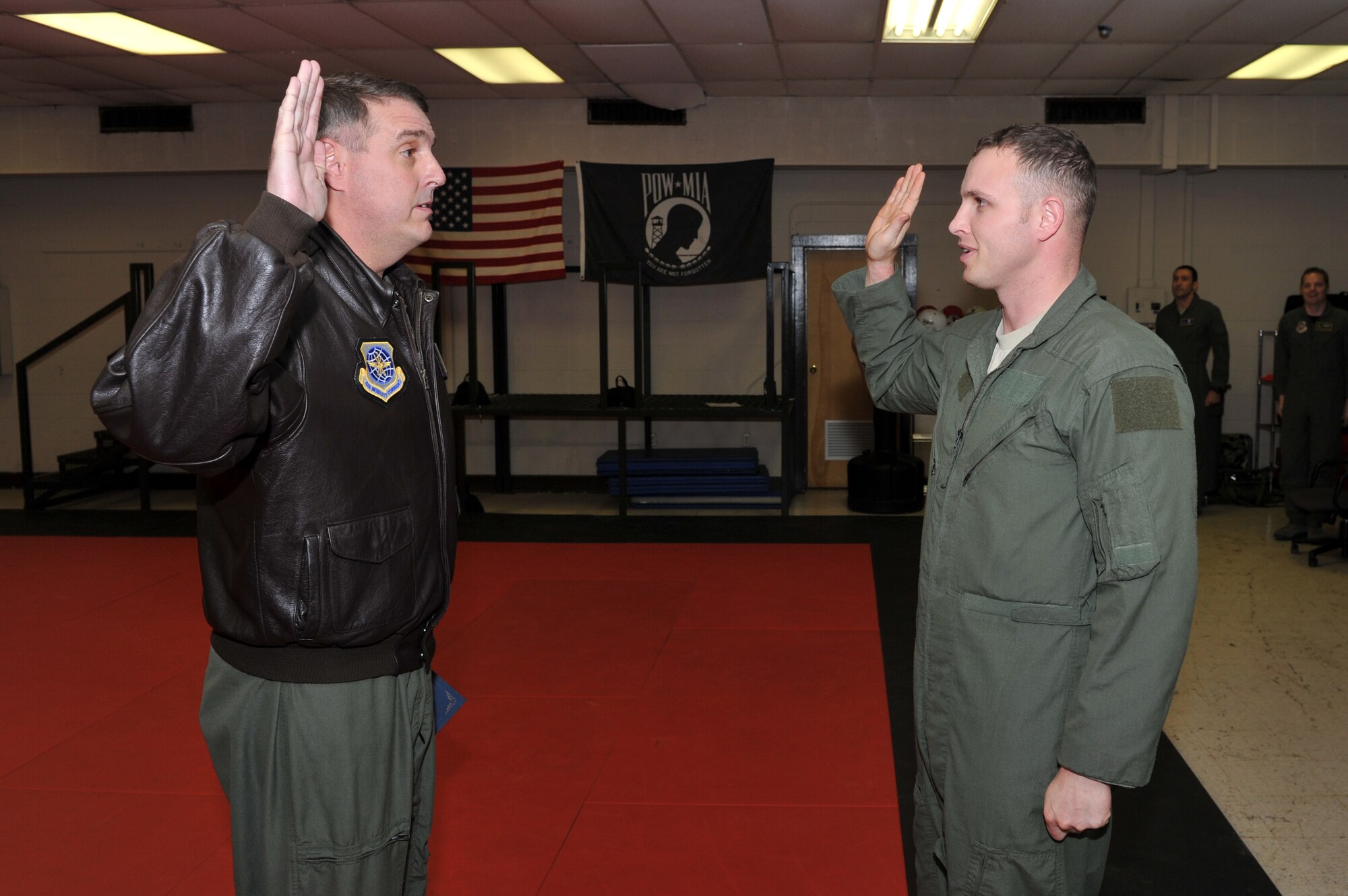 Col. Mike Minihan, 19th Airlift Wing commander, administers the enlisted oath to Staff Sgt. Joshua Taylor, 50th Airlift Squadron loadmaster, immediately before he was promoted to technical sergeant through the Stripes for Exceptional Performers program Jan. 4, 2011, at Little Rock Air Force Base, Ark. (U.S. Air Force photo by Staff Sgt. Chris Willis)