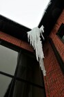 MINOT AIR FORCE BASE, N.D. -- An icicle dangling from the Francis X. Deignan Education Center and Library’s roof characterizes one of the many sights Minot Airmen see during a winter here. Frigid temperatures, a common occurrence in North Dakota, facilitate the formation of these beautiful ice formations on and off base. (U.S. Air Force photo /Senior Airman Michael J.Veloz)