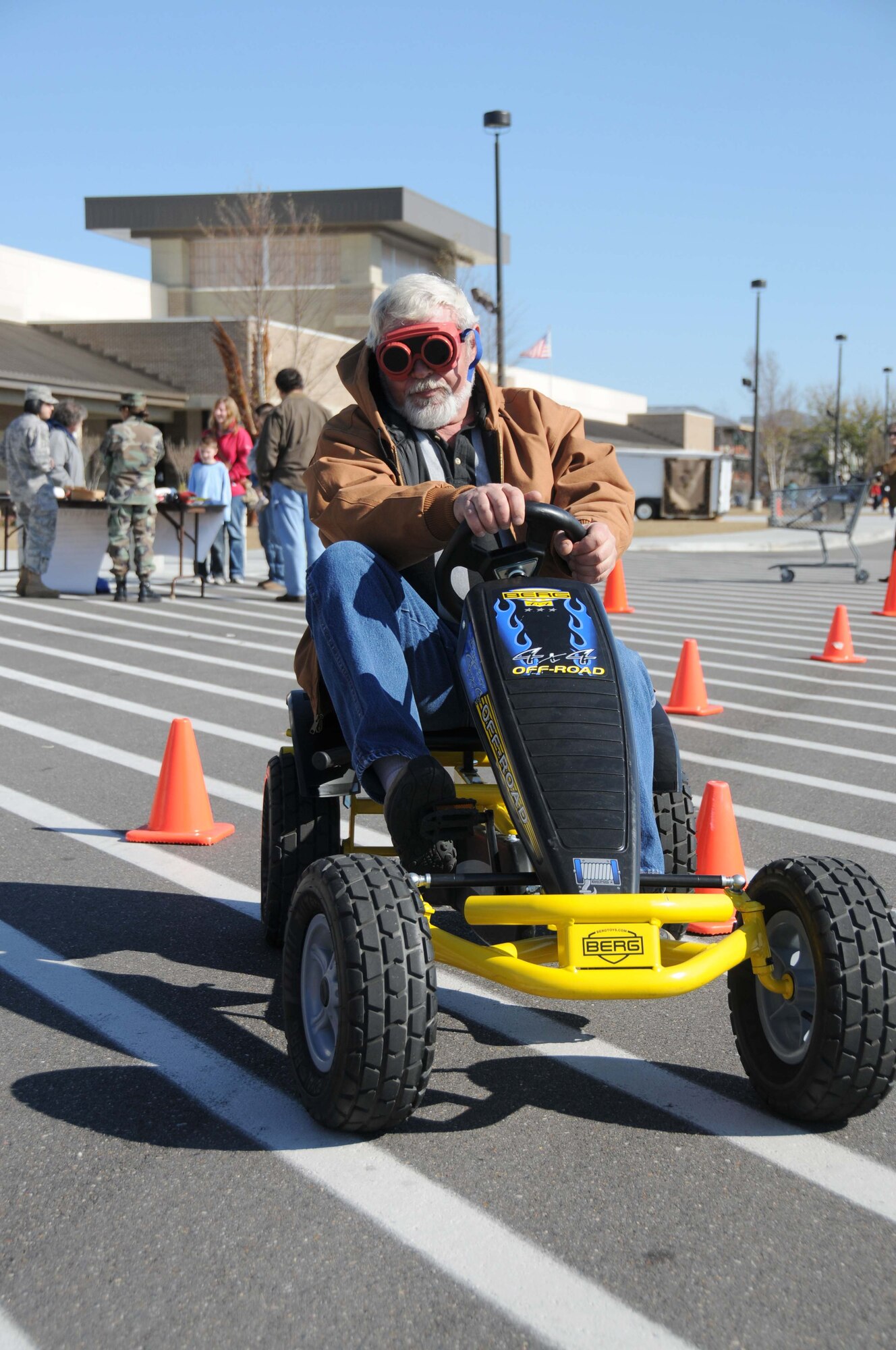Michael Diot, Army and Air Force Exchange Service loss prevention manager at Keesler, maneuvers through cones in the main exchange’s parking lot wearing “drunk
goggles” and driving a “drunk cart” Dec. 28. The demonstration was a joint effort between AAFES and the base’s alcohol and drug abuse prevention program to
educate store associates and customers on the dangers of drinking and driving, especially during the holidays.  (U.S. Air Force photo by Kemberly Groue)