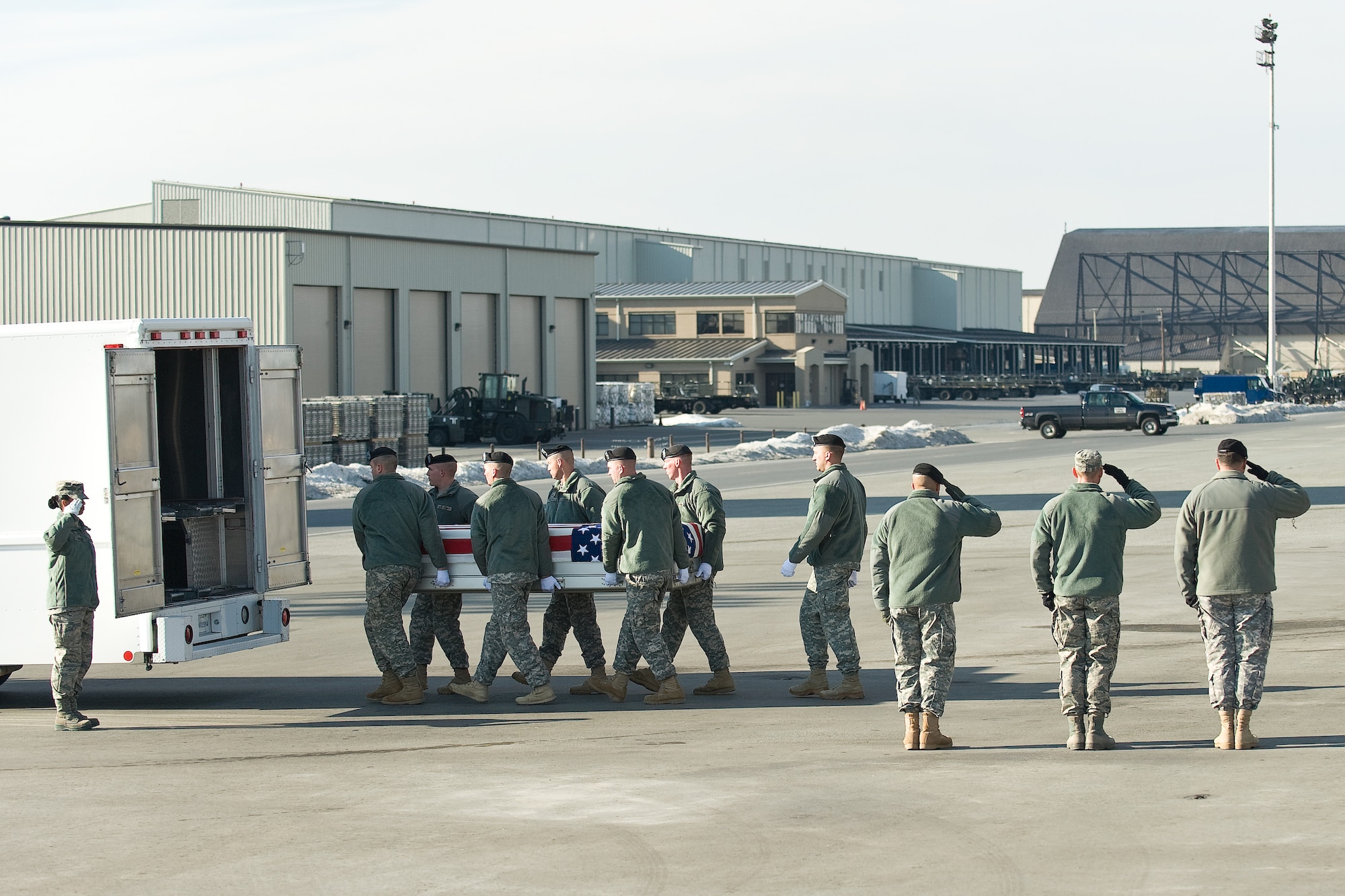 A U.S. Army carry team transfers the remains of Army Spc. Jose A. Delgado Arroyo, of San Juan, Puerto Rico, at Dover Air Force Base, Del., Jan. 5, 2011. Delgado Arroyo was assigned to the 1013th Engineer Company, 724th Engineer Battalion, Aquadilla, Puerto Rico. (U.S. Air Force photo/Roland Balik)