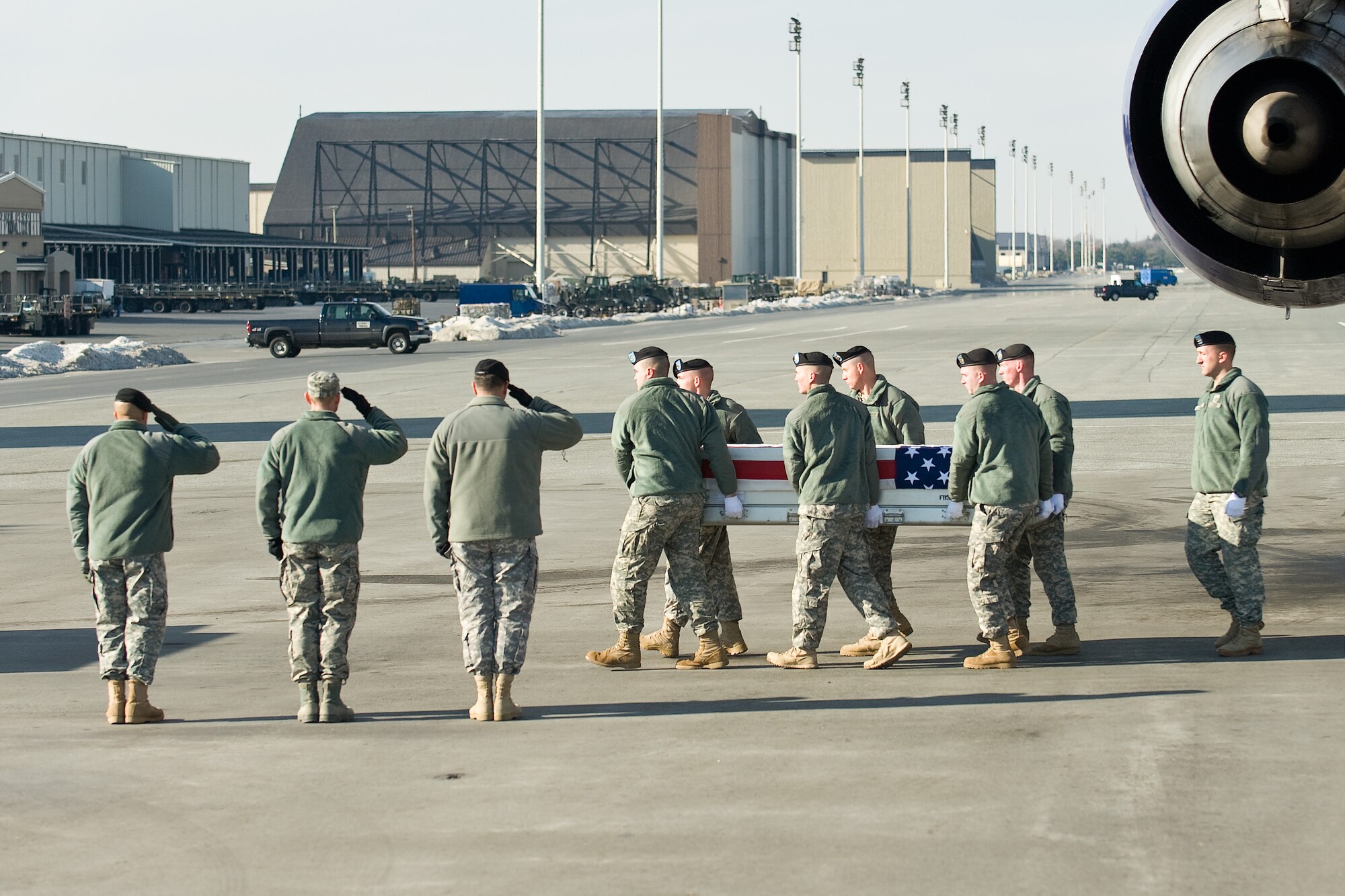 A U.S. Army carry team transfers the remains of Army Sgt. Jose M. Cintron Rosado, of Vega Alta, Puerto Rico, at Dover Air Force Base, Del., Jan. 5, 2011. Cintron Rosado was assigned to the 1013th Engineer Company, 724th Engineer Battalion, Aquadilla, Puerto Rico. (U.S. Air Force photo/Roland Balik)