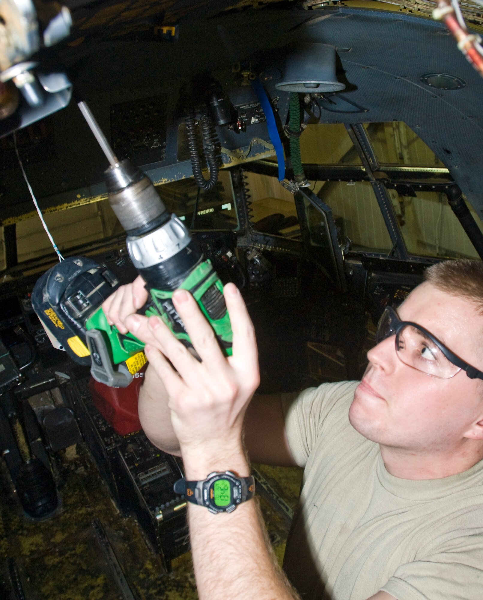 Airman 1st Class Max Evans, a 19th Equipment Maintenance Squadron crew chief, removes panel screws from a C-130 aircraft Tuesday. The refurbishment team takes out all removable equipment from the aircraft including storage bins, escape hatches, galley equipment, floorboards and seats. (U.S. Air Force photo by Staff Sgt. Nestor Cruz)