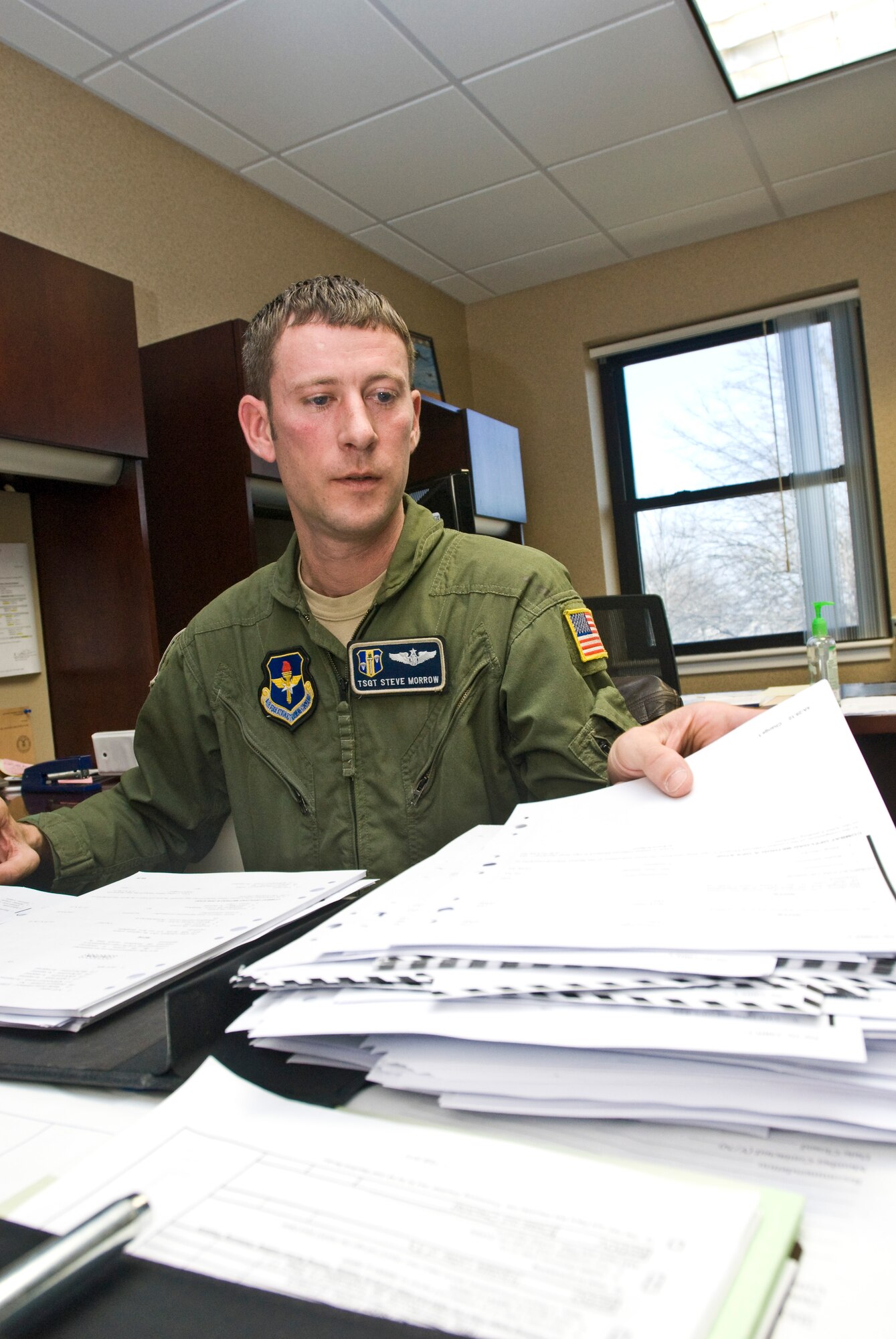 Tech. Sgt. Stephen Morrow, a 314th Operations Group C-130 flight engineer, puts together a flight manual Wednesday. The Savona, N.Y., native integrated seven 314th OG supplements into Air Force instructions, helping to lead the group to an overall “excellent” rating during the recent Aircrew Standardization Evaluation Visit. (U.S. Air Force photo by Staff Sgt. Nestor Cruz)
