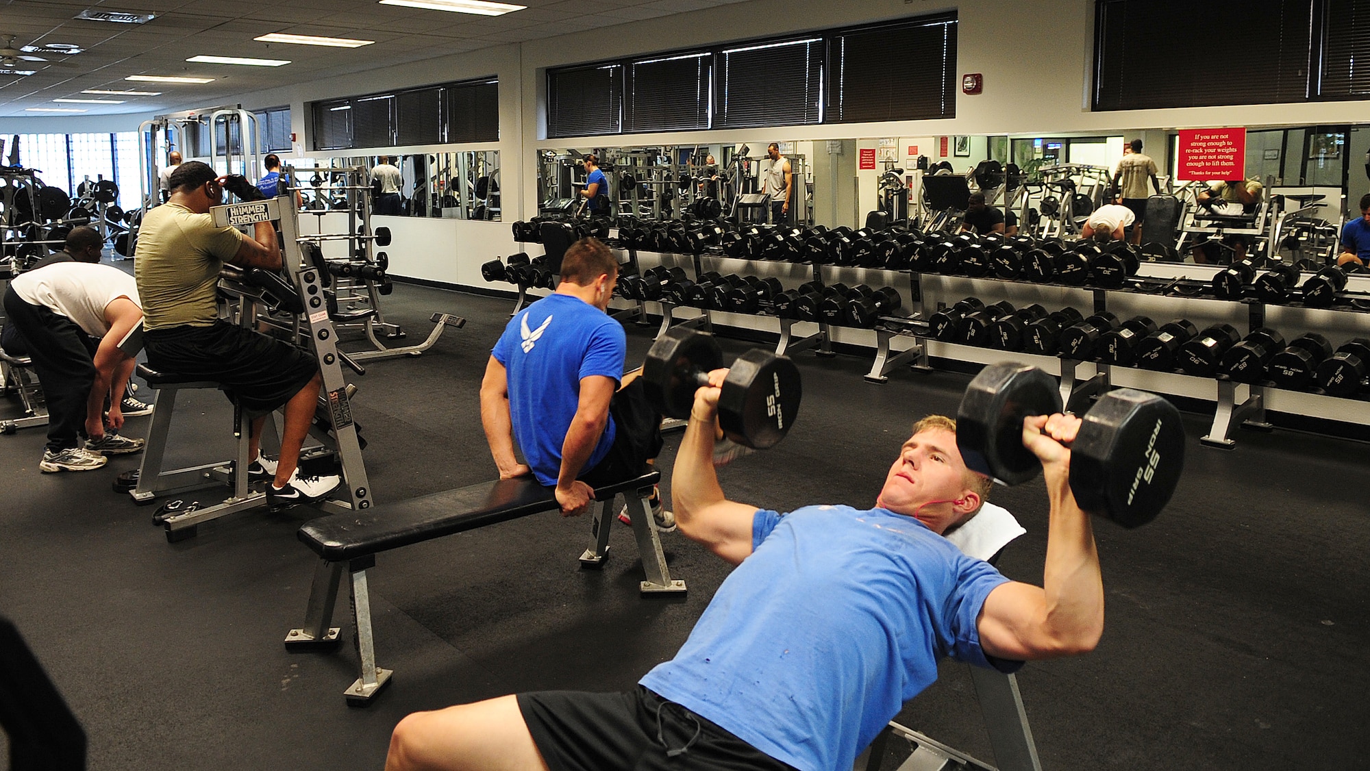 MOODY AIR FORCE BASE, Ga. -- Airmen use dumbbells and weight machines to work out different muscle groups Jan. 5. In addition to cardiovascular exercises, weight training should also be incorporated to provide an effective  workout. (U.S. Air Force photo/Senior Airman Stephanie Mancha)(RELEASED)