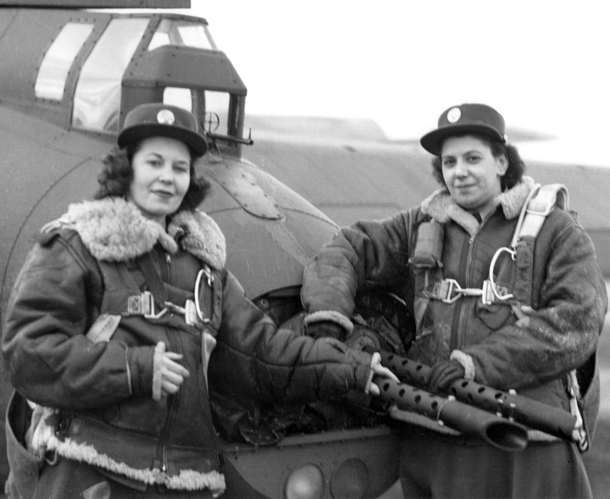 WACs pose by the tail guns of a 401st BG B-17 at an 8th Air Force base in England in January 1944.