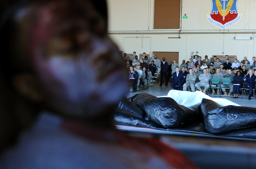 MOODY AIR FORCE BASE, Ga.-- Tech. Sgt. Christopher Hughes, 23rd Civil Engineer Squadron quality assurance, sits in a wrecked vehicle as members of the 23rd Wing observe an accident demonstration hosted by the 23rd WG Safety office Jan. 3. Sergeant Hughes was a simulated drunk driver that crashed his vehicle, killing himself and two other passengers. (U.S. Air Force photo/Airman 1st Class Benjamin Wiseman)(RELEASED)