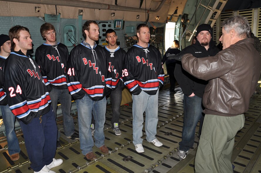 WRIGHT-PATTERSON AIR FORCE BASE, Ohio – Master Sgt. Mike Steele, 89th Airlift Squadron, explains the cargo area of a C-5 Galaxy to players from the Dayton Gems Hockey Team Jan. 4.  Twenty-five players and staff from the Dayton Gems toured the aircraft as part of their visit to Wright-Patterson Air Force Base. (U.S. Air Force photo/Senior Airman Mikhail Berlin)