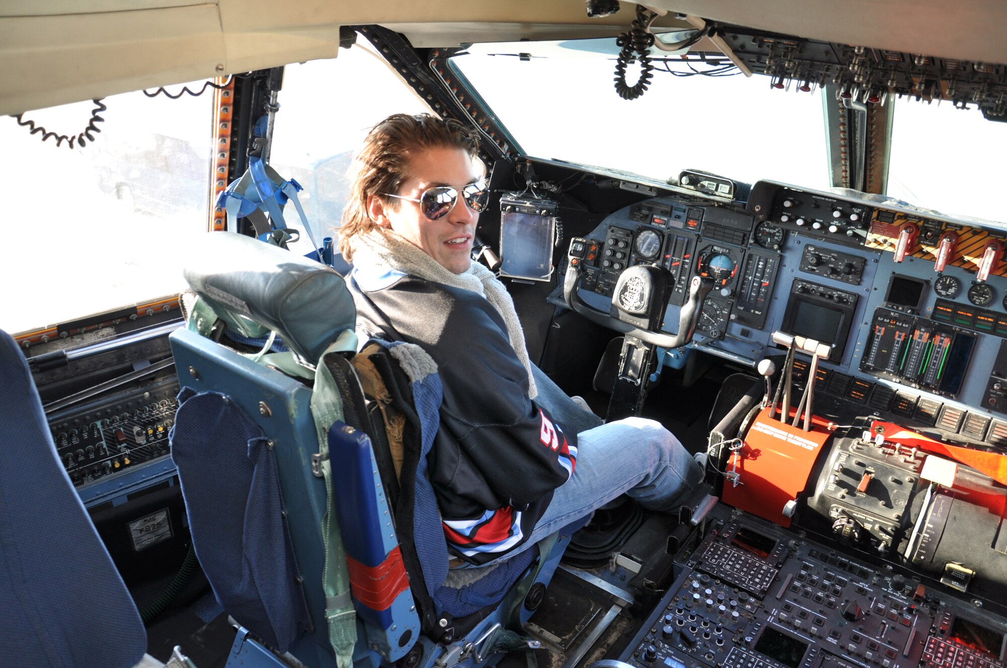 WRIGHT-PATTERSON AIR FORCE BASE, Ohio – Dayton Gems hockey player, Jonathan Ornelas, enjoys a tour of the flight deck of a C-5 Galaxy while visiting the 445th Airlift Wing Jan. 5.  Twenty-five players and staff from the Dayton Gems Hockey Team enjoyed the tour as part of their orientation visit to Wright-Patterson Air Force Base, Ohio. (U.S. Air Force photo/Senior Airman Mikhail Berlin)