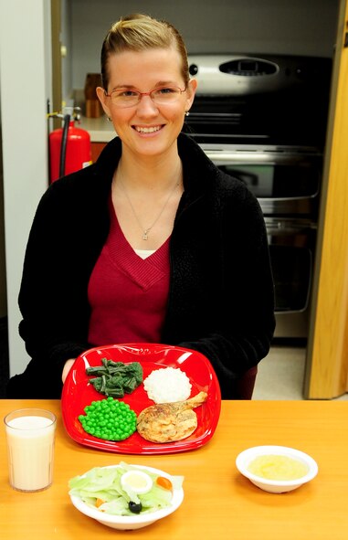 MOODY AIR FORCE BASE, Ga. -- April King, 23rd Aerospace Medicine Squadron exercise physiologist, demonstrates a well-balanced meal Jan. 5.  Eating healthy provides the body with the nutrients and energy it needs to function properly. (U.S. Air Force photo/Senior Airman Stephanie Mancha)(RELEASED)