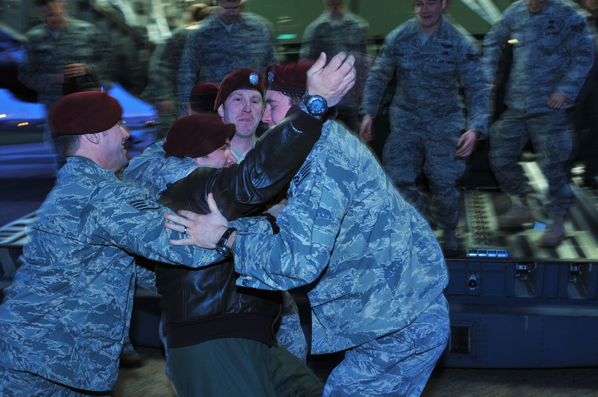 Before deploying to Southwest Asia, Pararescuemen from the 56th Rescue Squadron give a “dog-pile” goodbye to Tech. Sgt. Marshall Jordan, NCO in charge of the pararescue team, before boarding a C-17 Globemaster at RAF Lakenheath, England, Jan. 4. Pararescue jumpers, or PJs, make up an elite corps responsible for combat search and rescue missions.  (U.S. Air Force photo by Staff Sgt. Connor Estes)