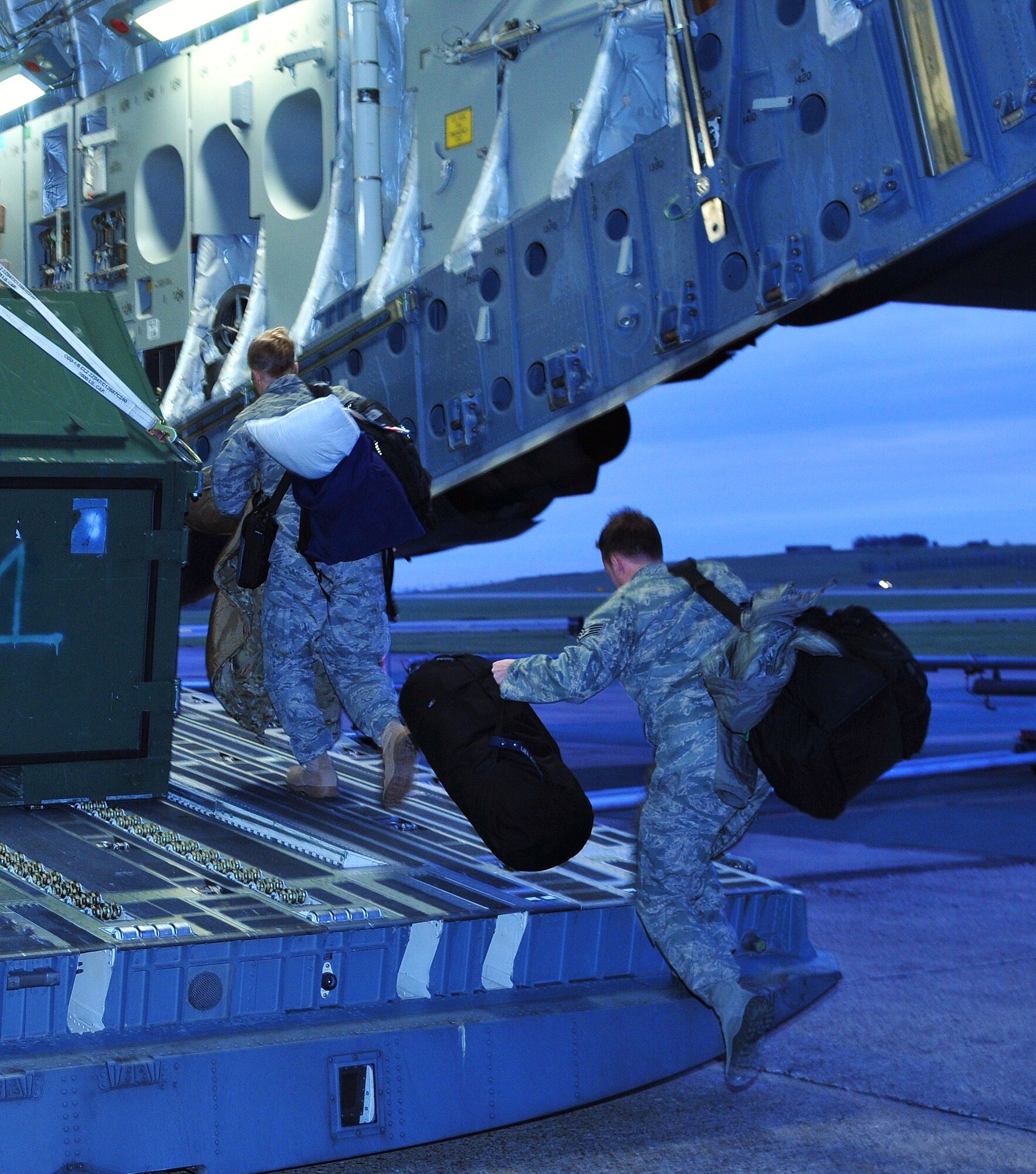 Pararescuemen from the 56th Rescue Squadron load their bags on a C-17 Globemaster for a deployment to Southwest Asia from RAF Lakenheath, England, Jan. 4. Pararescue jumpers are certified scuba divers and skilled in surface water operations. They're also trained combat medics and certified emergency medical technician paramedics.  (U.S. Air Force photo by Staff Sgt. Connor Estes)