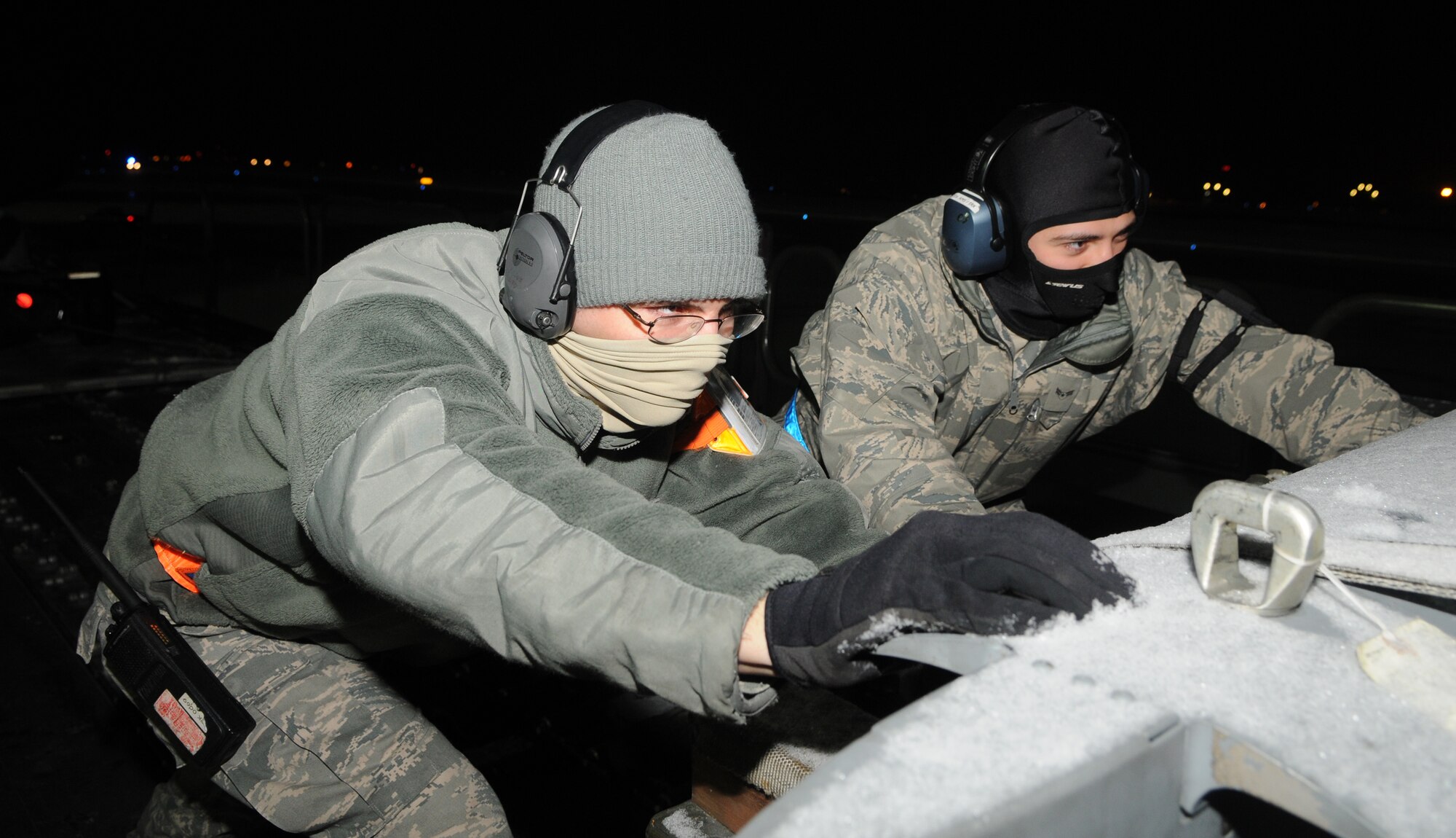 SPANGDAHLEM AIR BASE, Germany – Senior Airman Nicholas Sbano and Airman 1st Class Andrew DaSilva, 726th Air Mobility Squadron air services journeymen, load cargo on a McDonnel Douglas MD-11F during a cargo upload process Jan. 5.  The cargo was flown to Nellis Air Force Base, Nev., to support the 480th Fighter Squadron during a Red Flag training exercise. The 480th FS will be participating in Red Flag from Jan. 22 – Feb.  4. (U.S. Air Force photo/Senior Airman Nick Wilson)